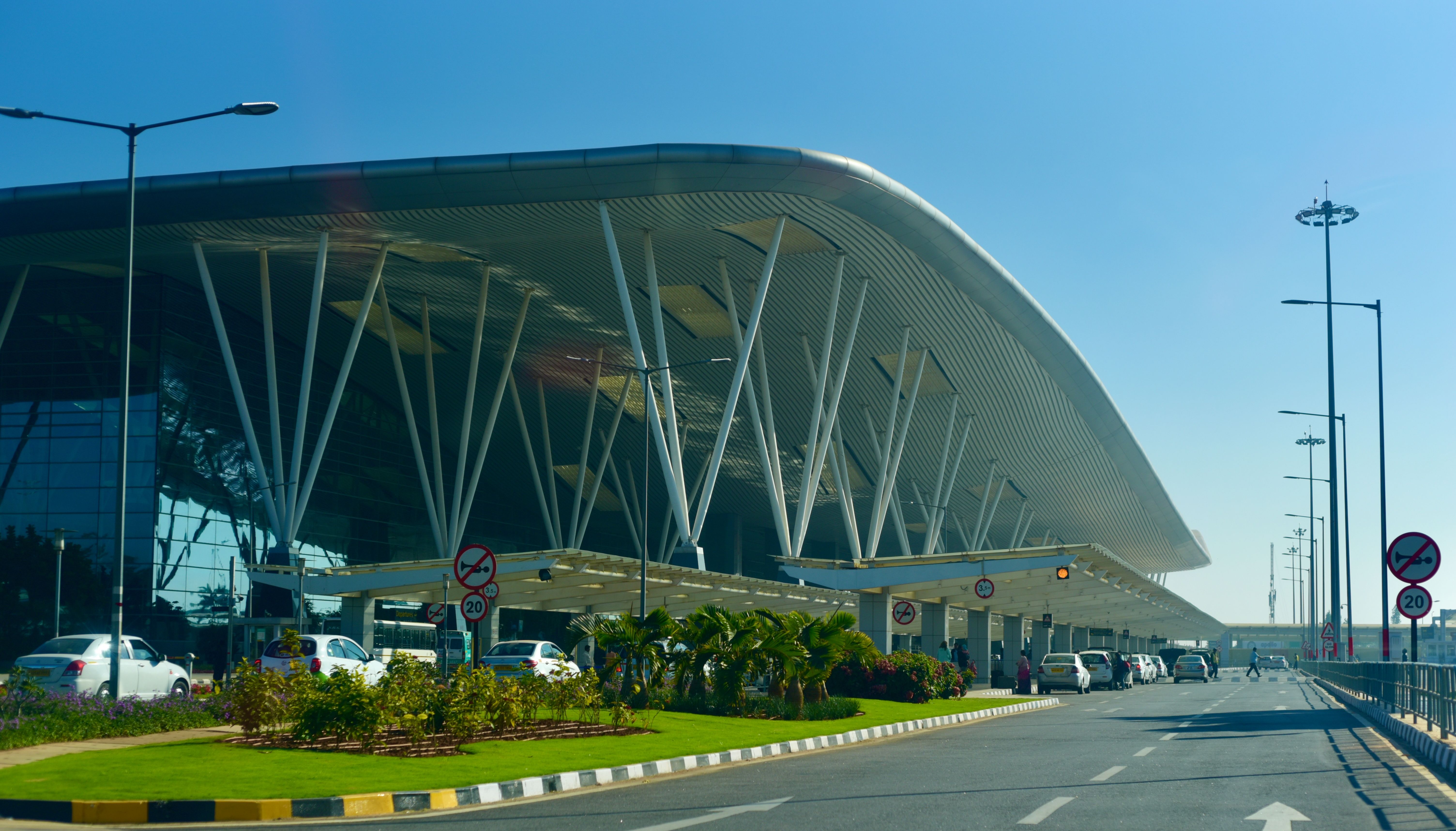 The outside of Bengaluru (BLR) Kempegowda International Airport is an international airport serving Bangalore / 