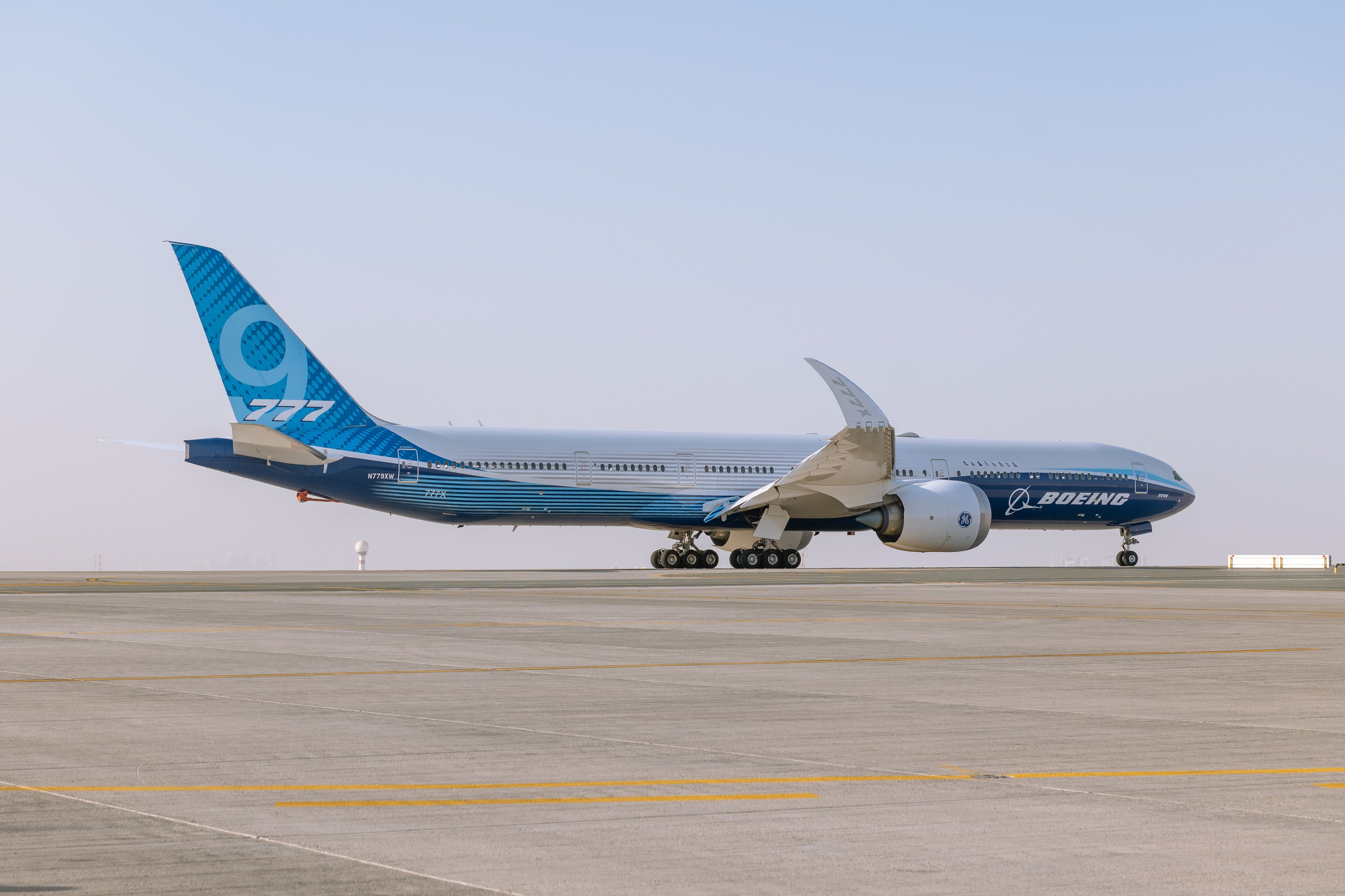 A Boeing 777-9 taxiing at an airport.