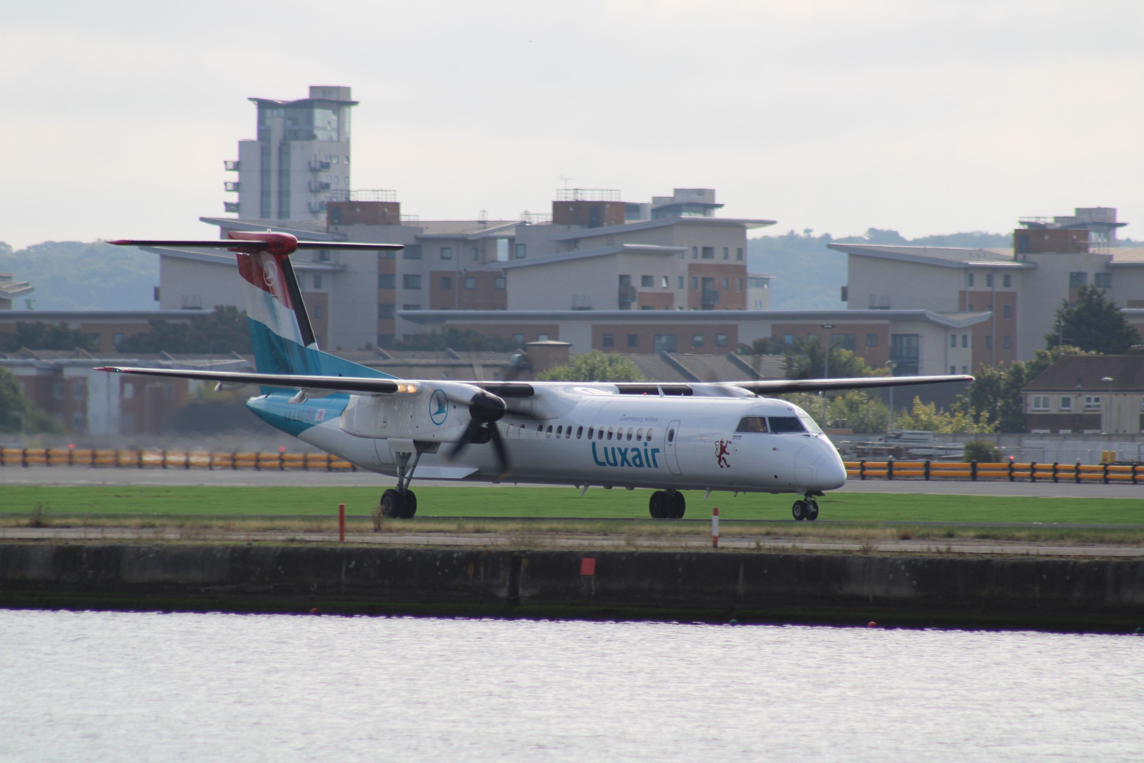 A Luxair Dash 8 Taxiing At London City Airport.