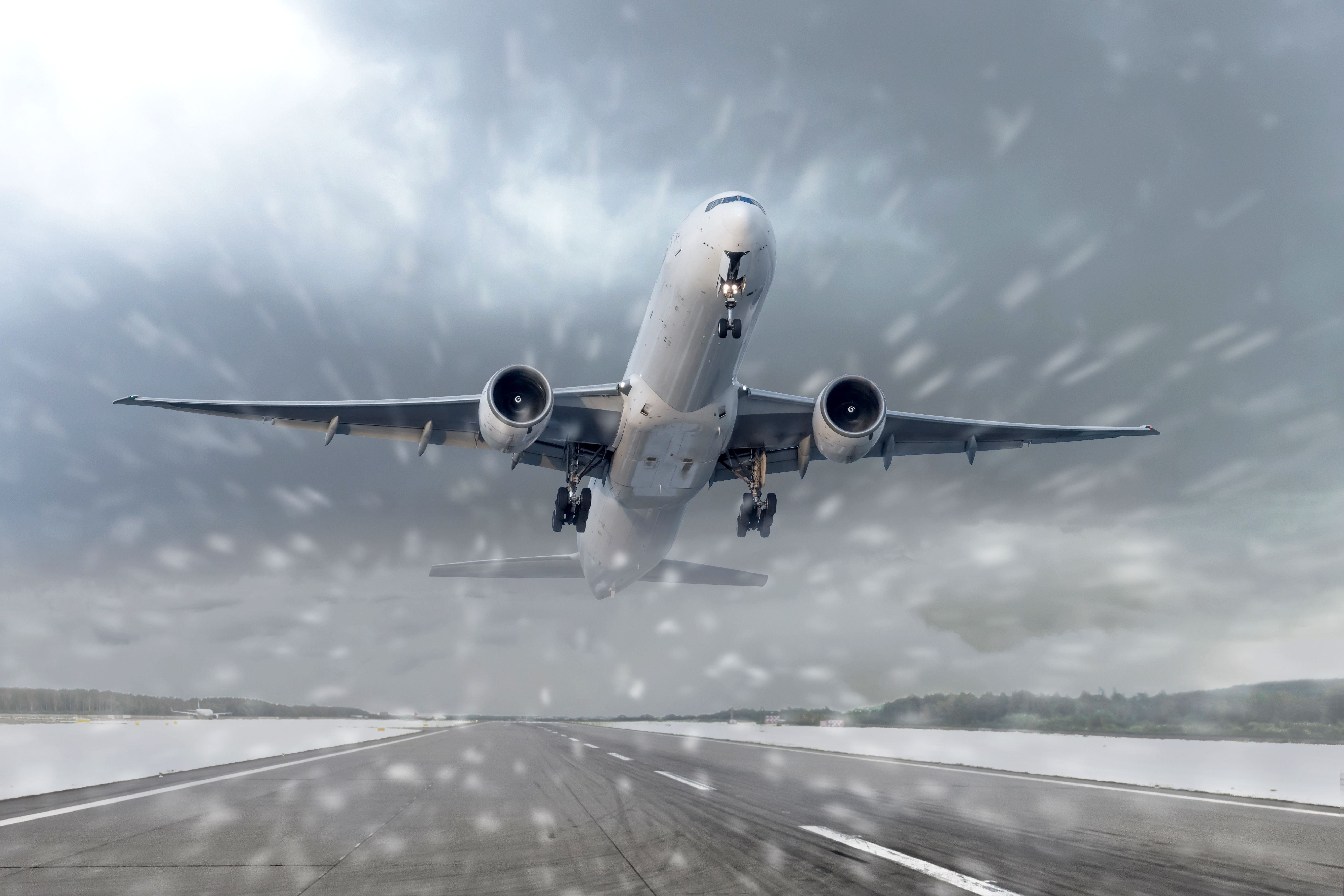 An Aircraft taking off in heavy snow.