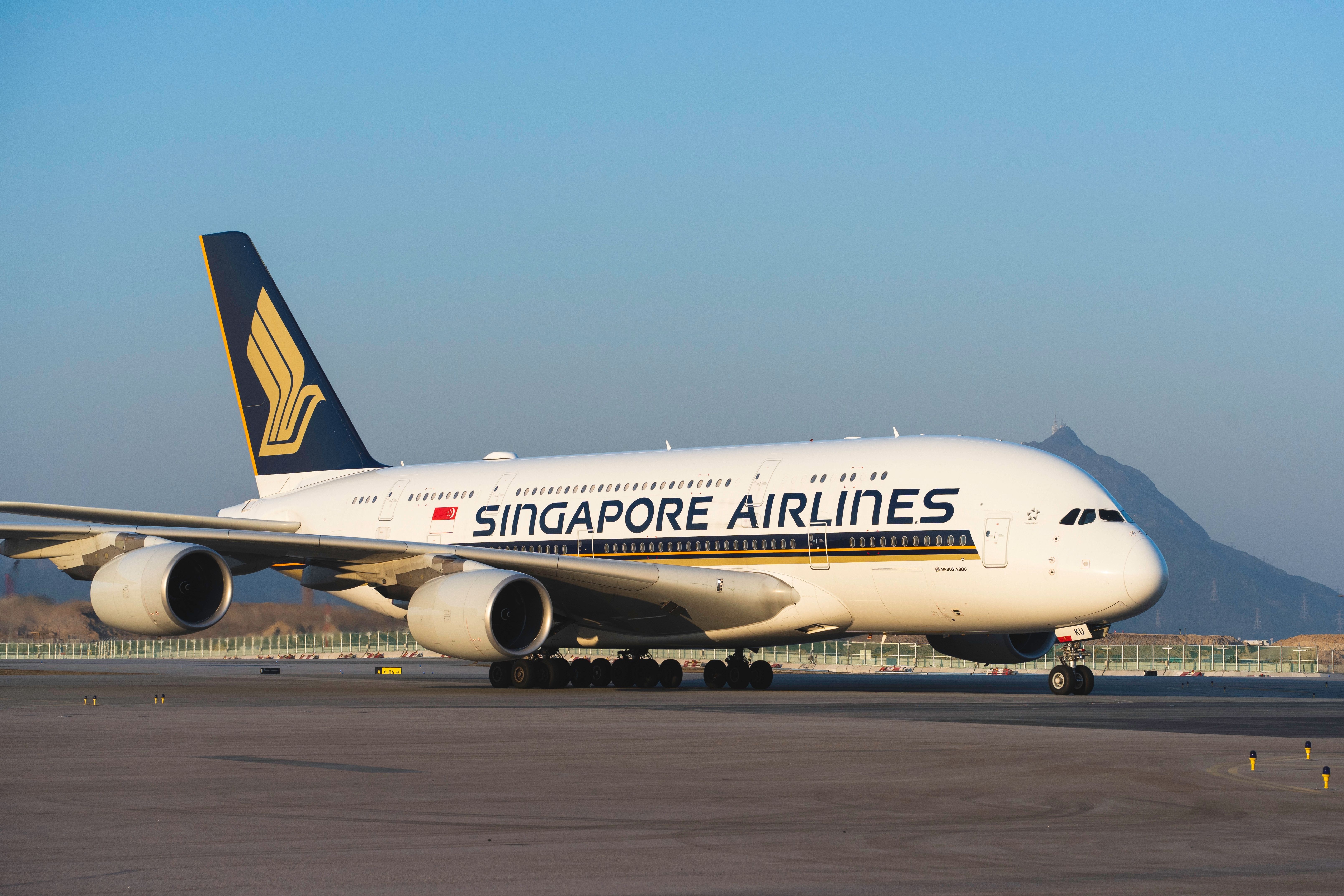 A Singapore Airlines Airbus A380 parked at an airport.
