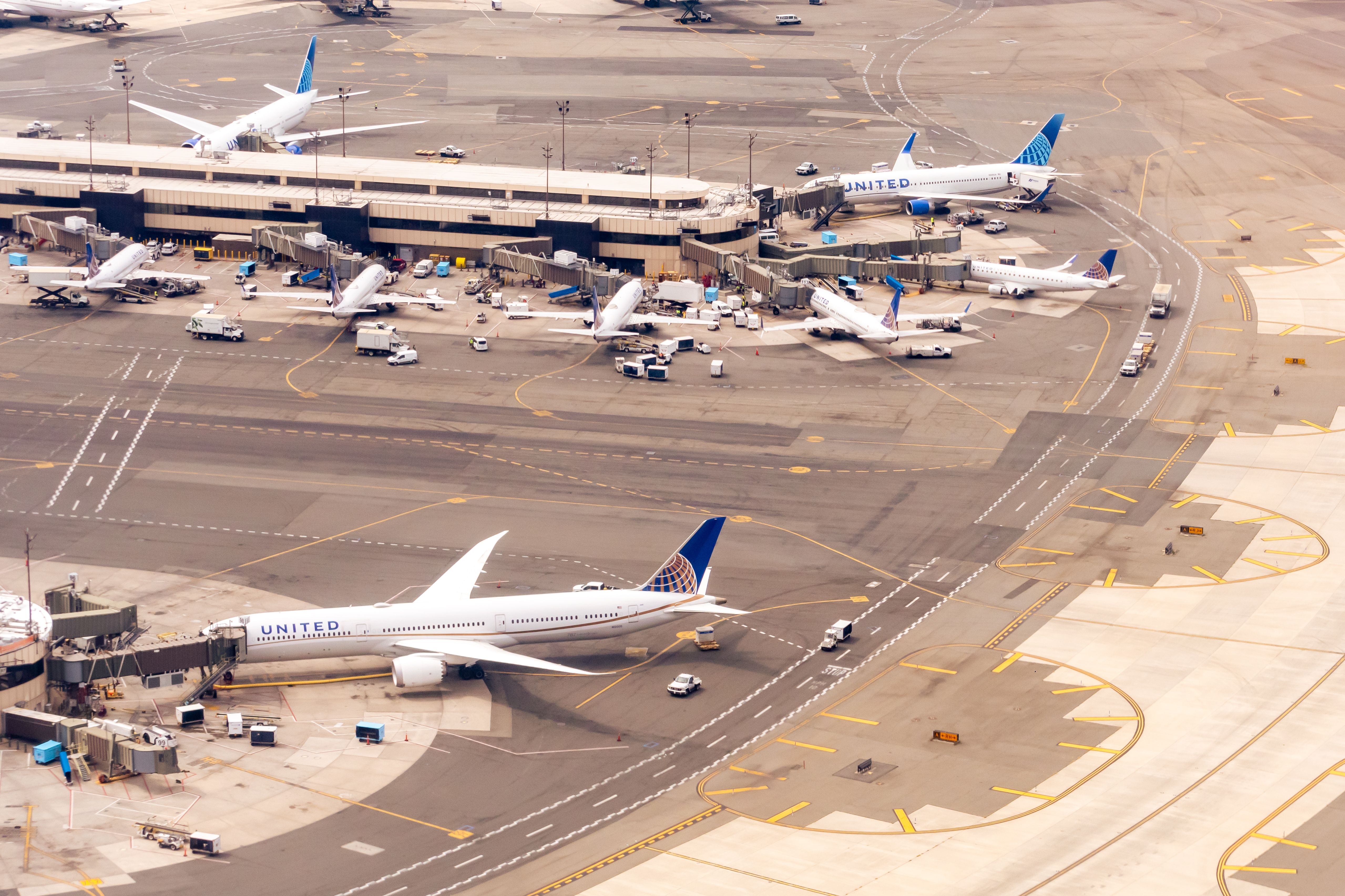 Multiple United Airlines aircraft parked at Newark Airport.