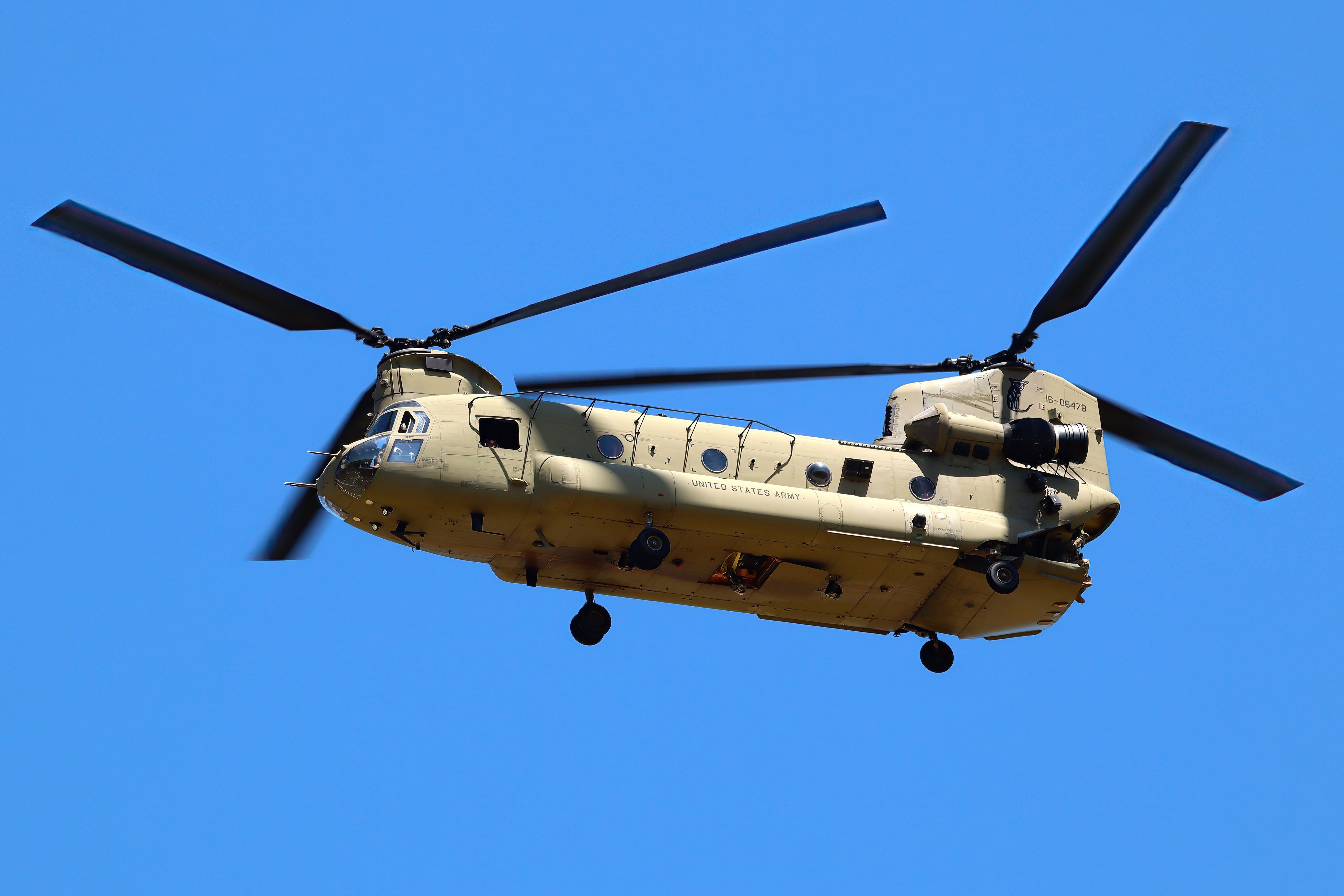 A United States Army Boeing CH-47 Chinook flying in the sky.