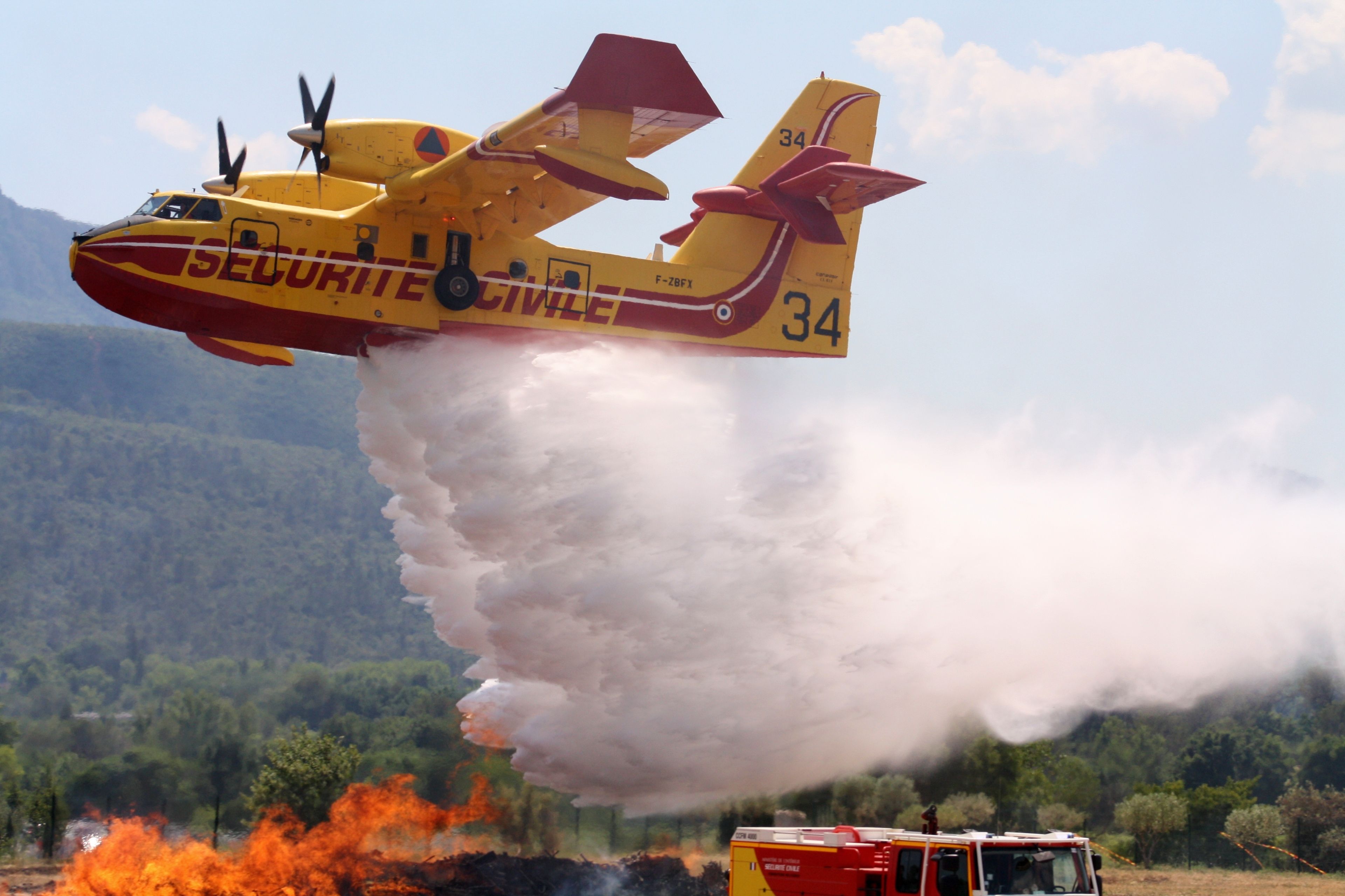 A Canadair aircraft being used to put out a wildfire.