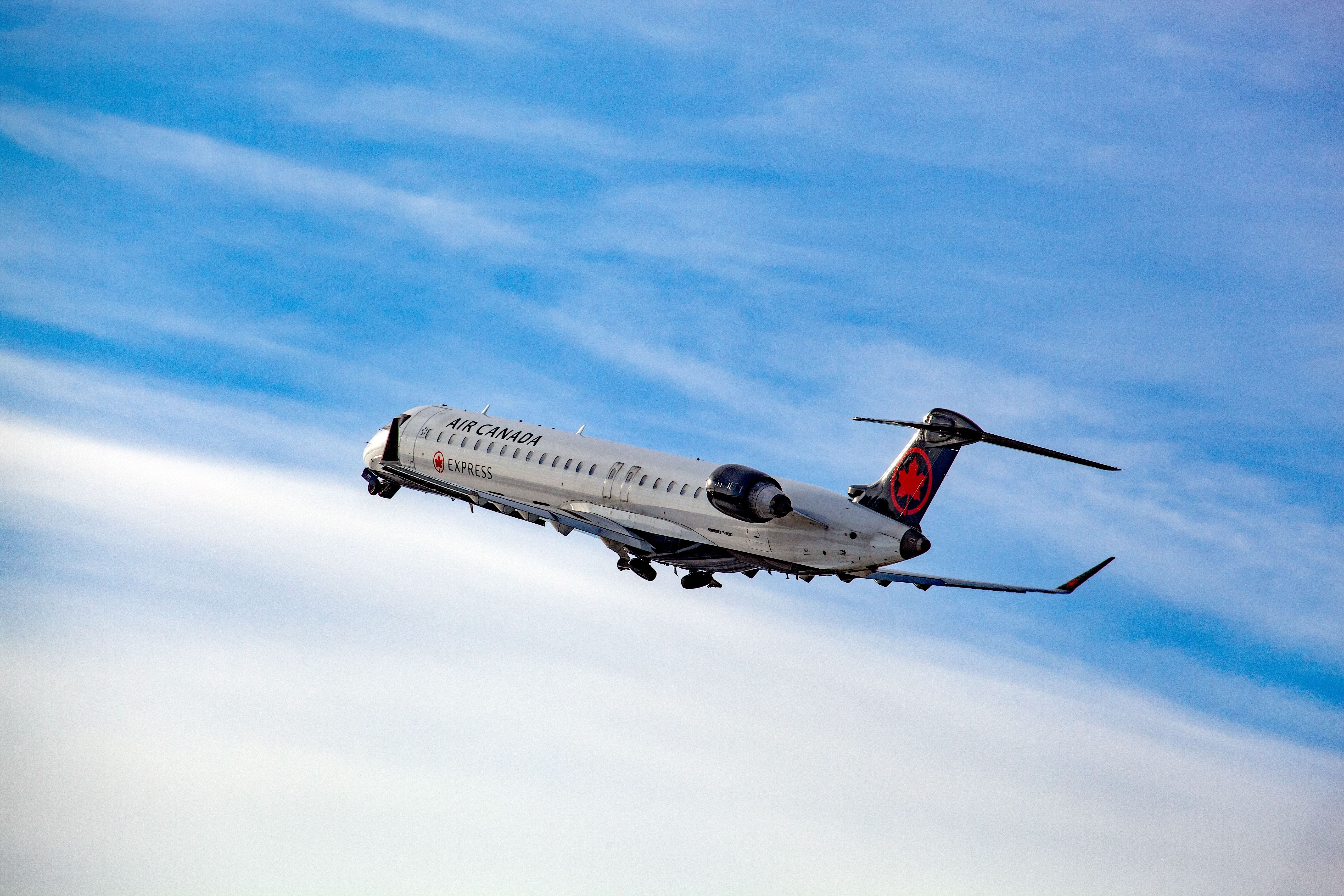 An Air Canada Express Bombardier CRJ-900 takes off from Montreal International Airport.