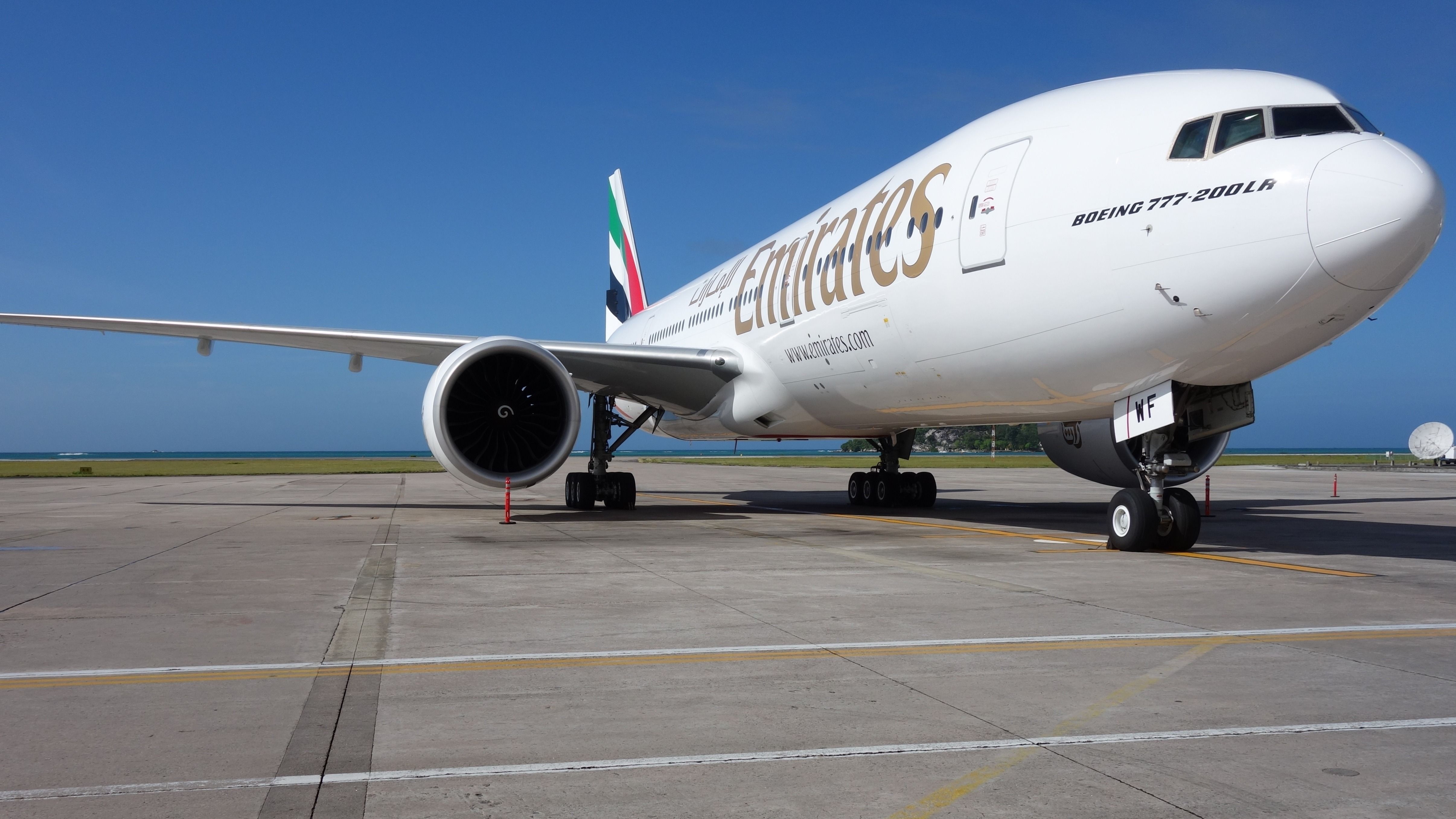 Emirates Boeing 777-200LR parked at an airport