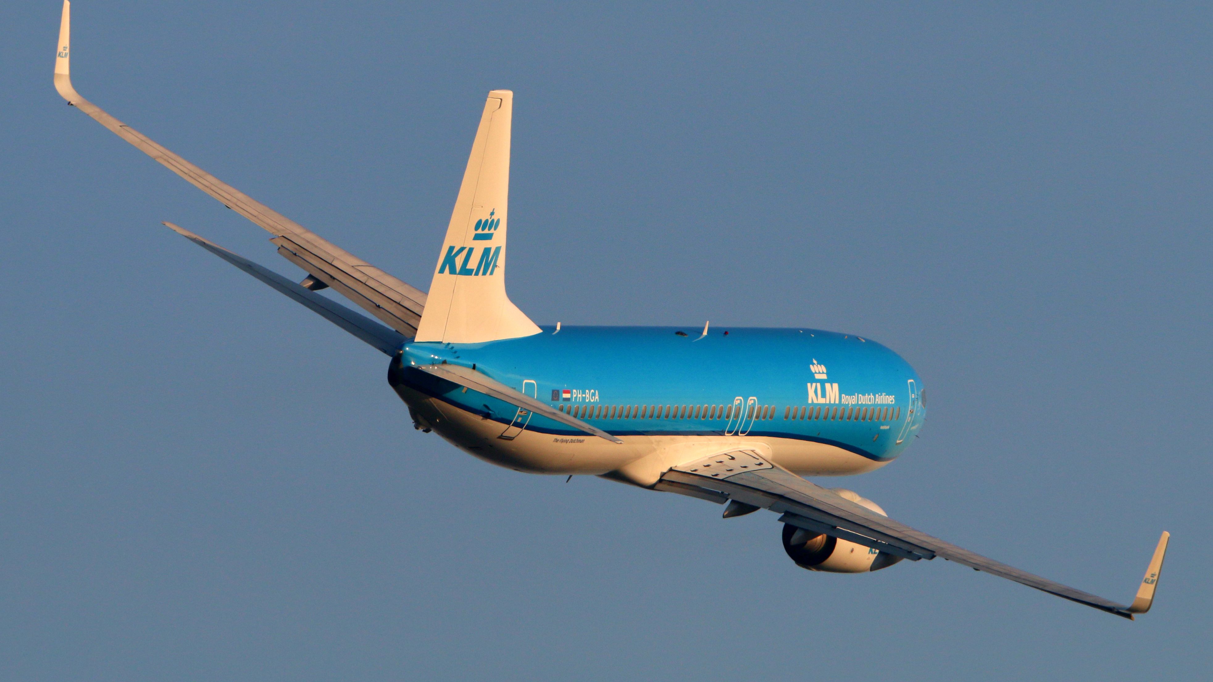 A KLM aircraft making a turn in the sky.