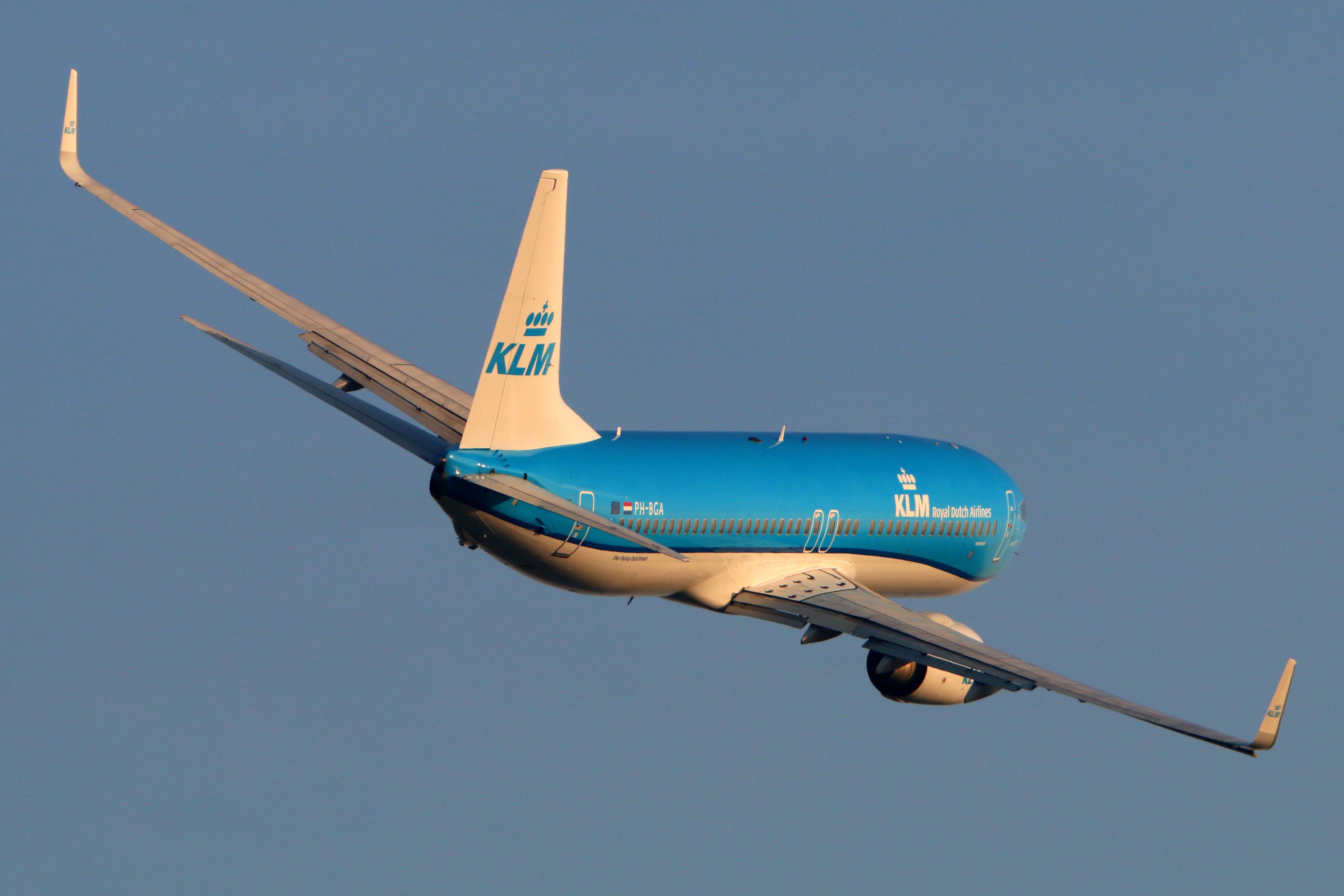 A KLM aircraft making a turn in the sky.