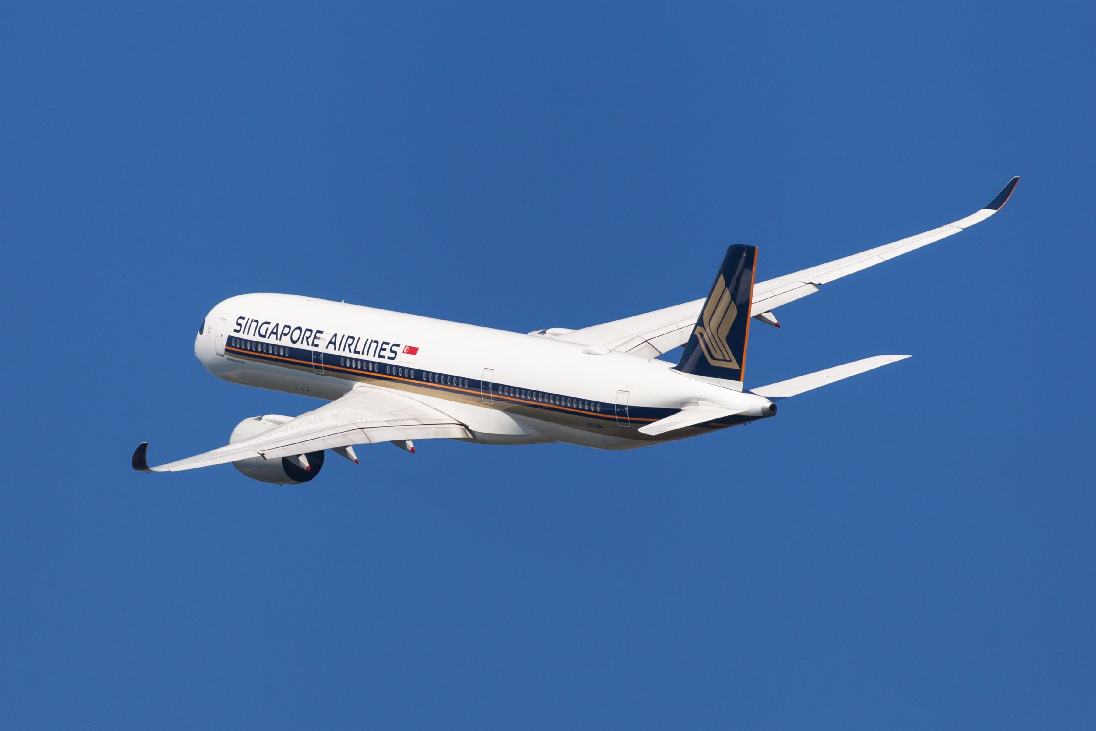 A Singapore Airlines A350-900 flying in the sky.