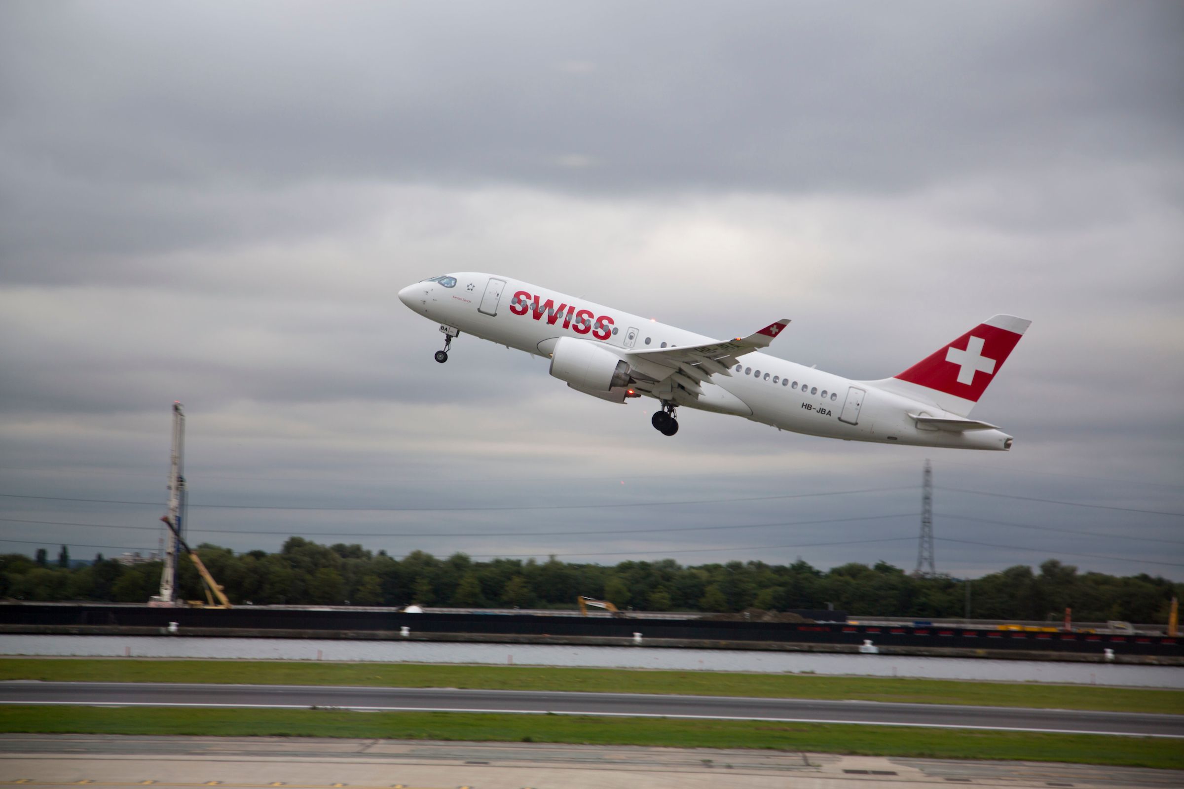 A SWISS Airbus A220 Departing From London City Airport.