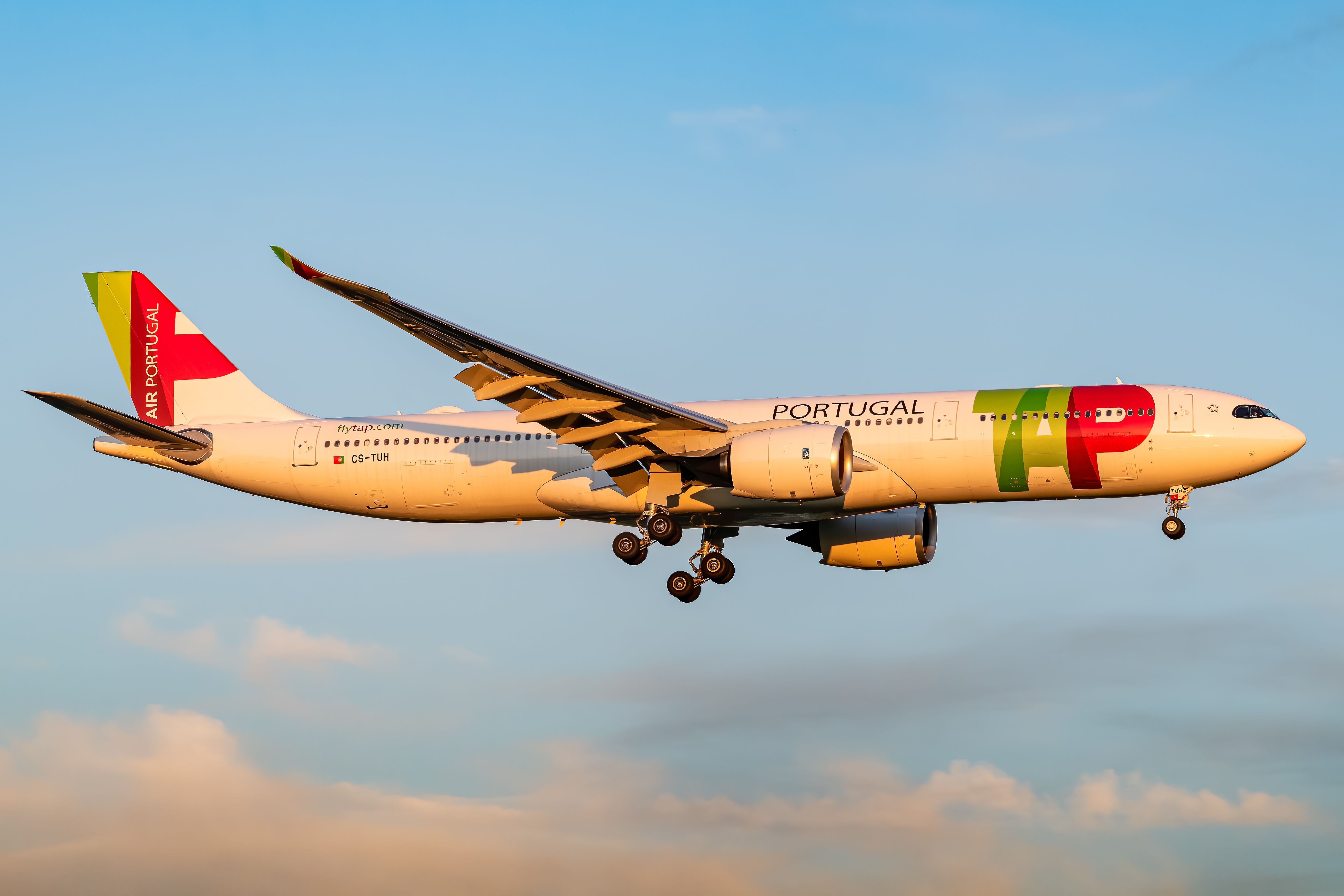 A TAP Air Portugal Airbus A330-900 flying in the sky.
