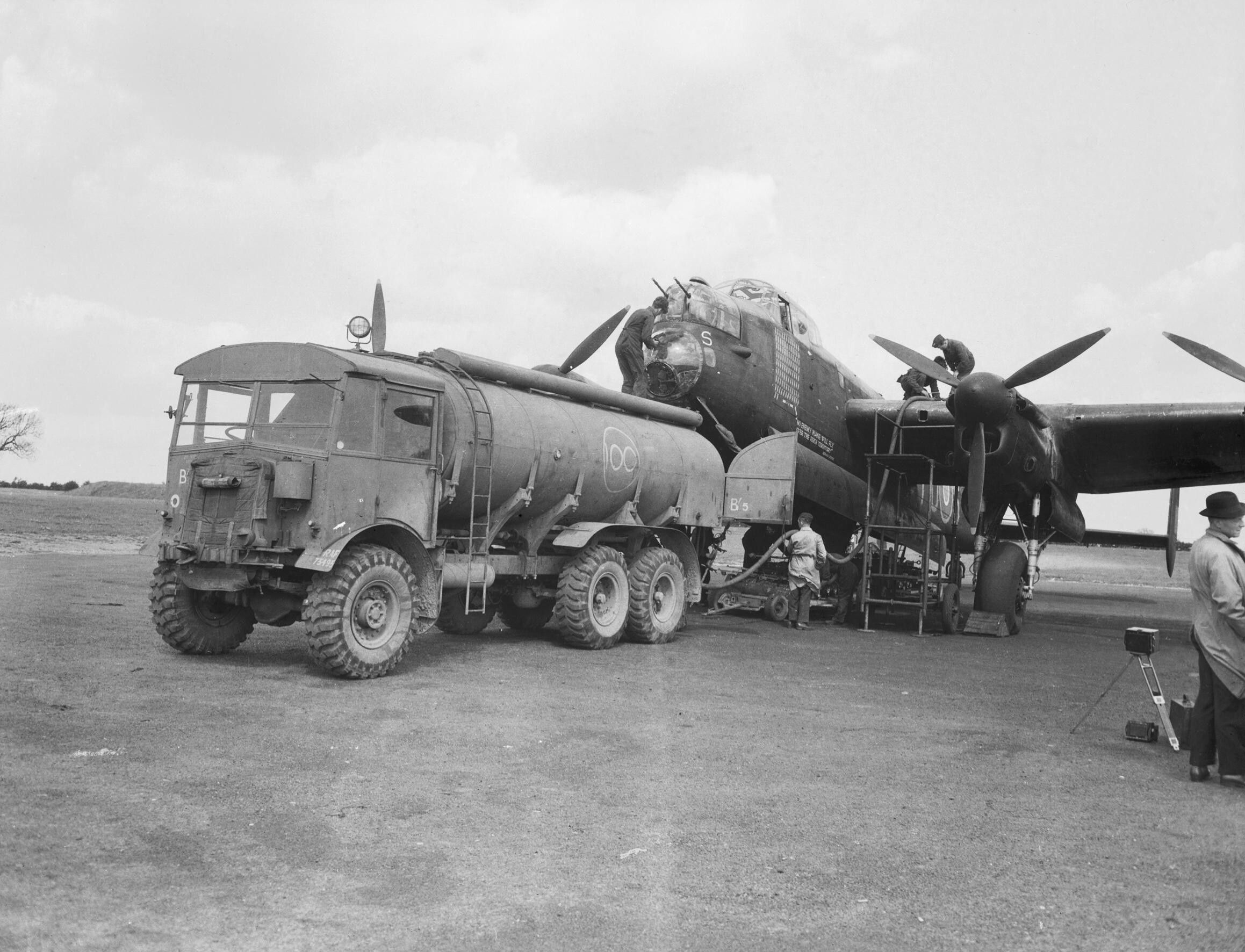 An RAF Avro Lancaster being maintained at an airfield.