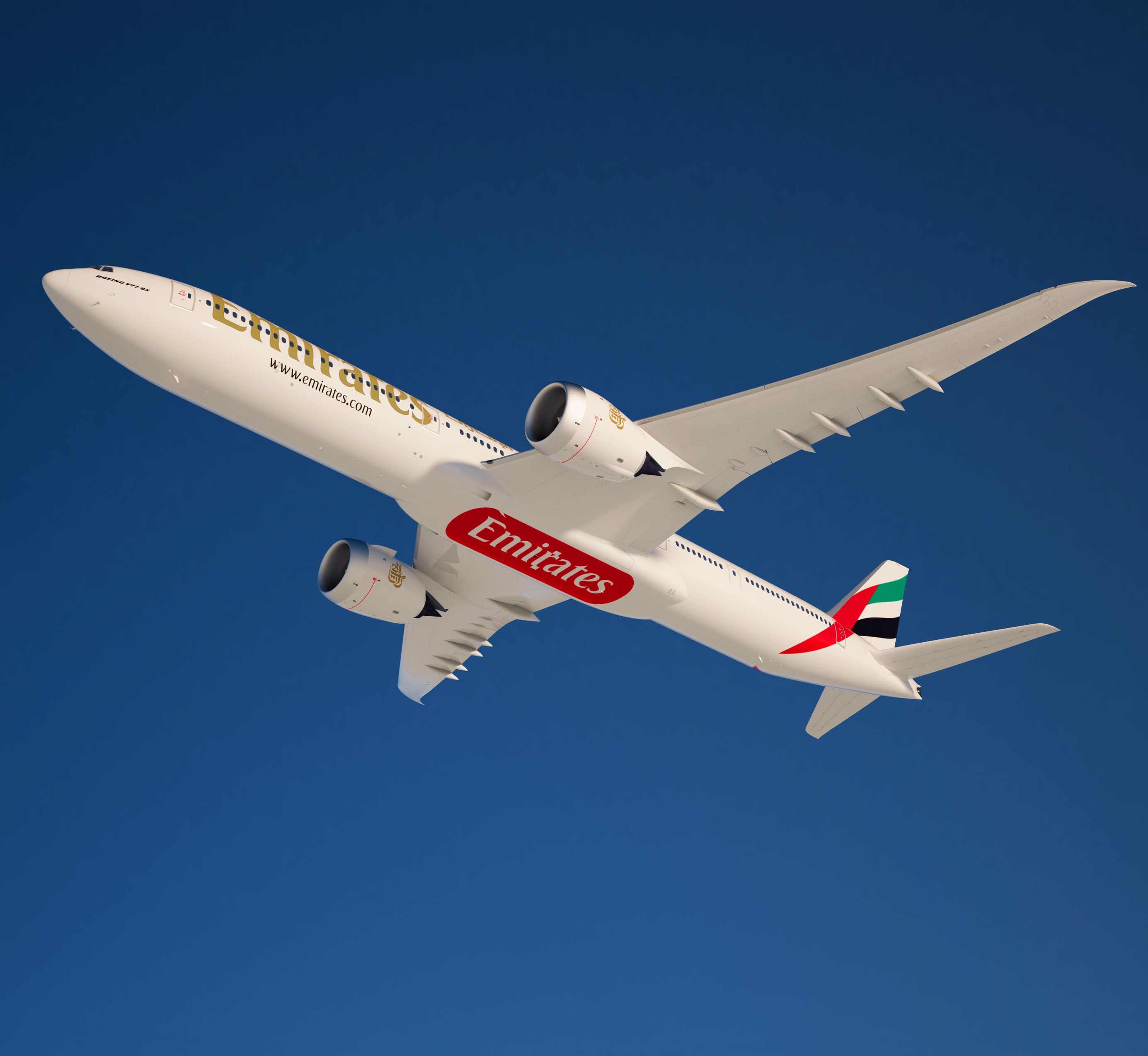 An Emirates 777X flying in the sky.