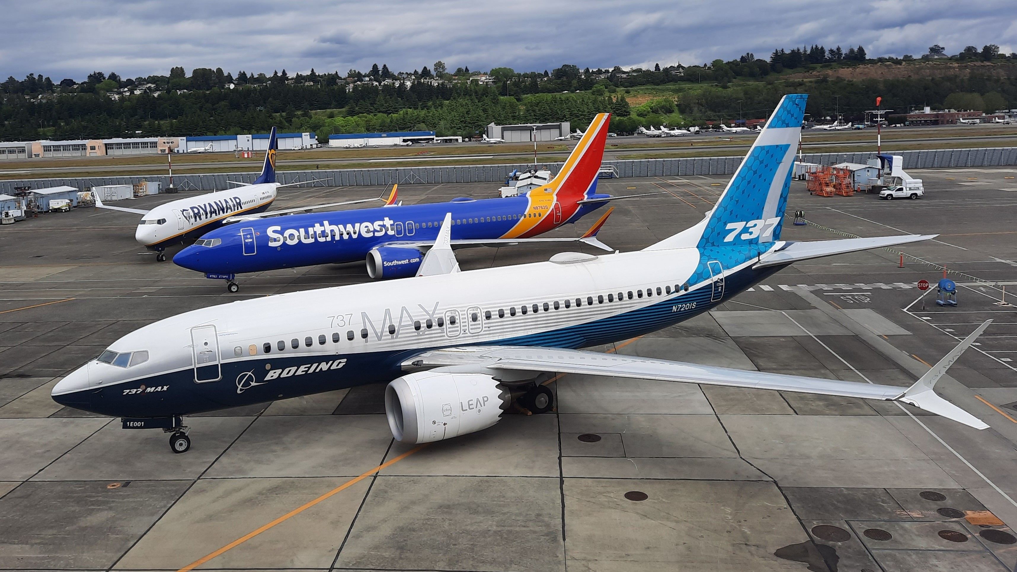 Three Boeing 737 MAX Family Aircraft Parked Together in Ryanair, Southwest, and house liveries.