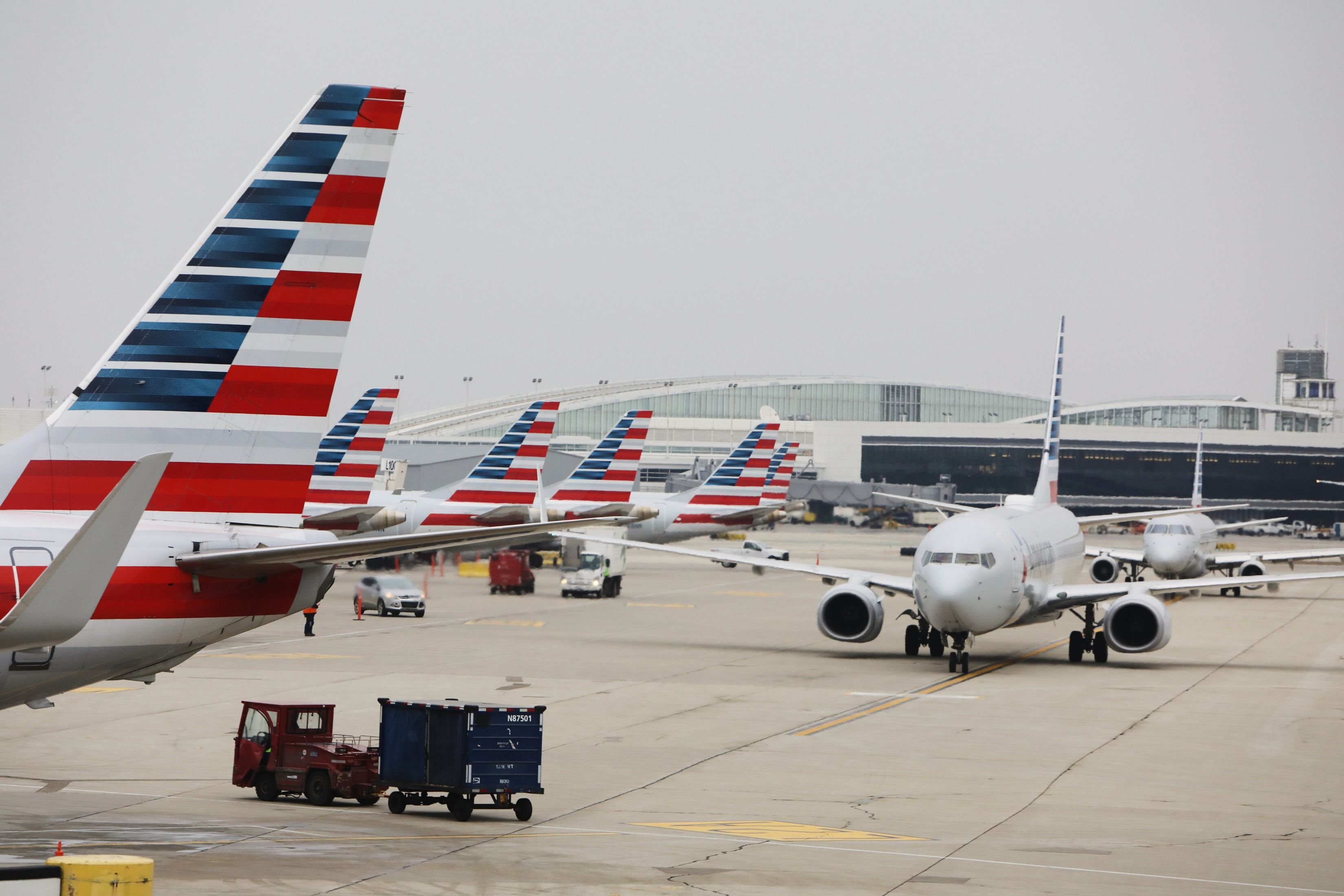 Several American Airlines aircraft parked at an airport.