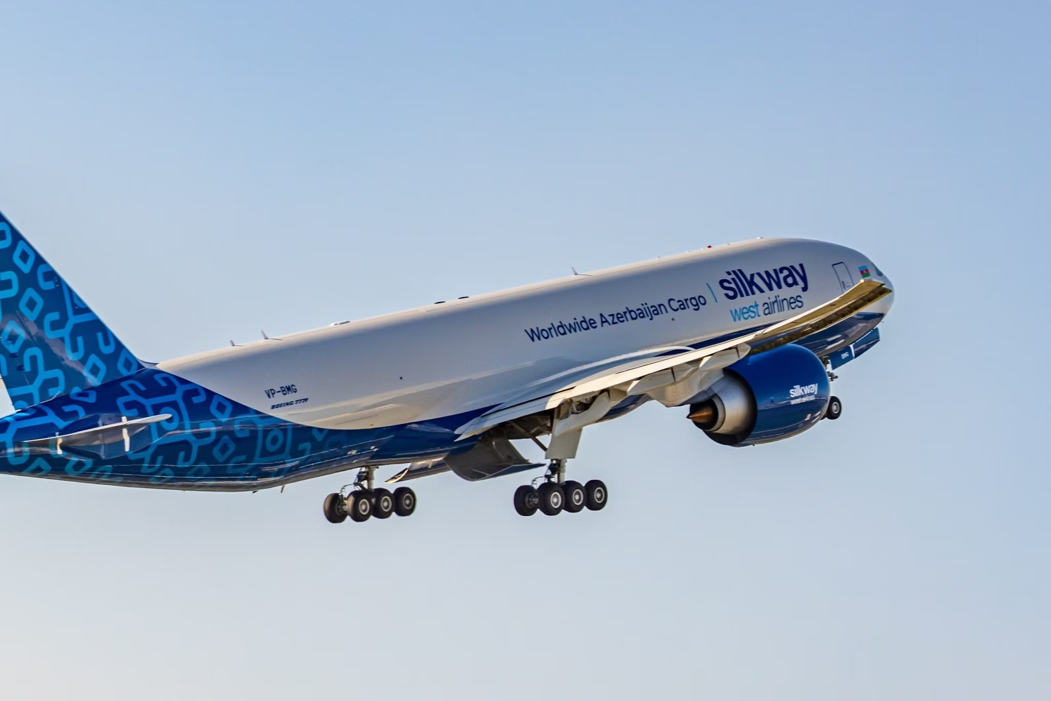 A Silk Way West Airlines Boeing 777F aircraft flying in the sky.