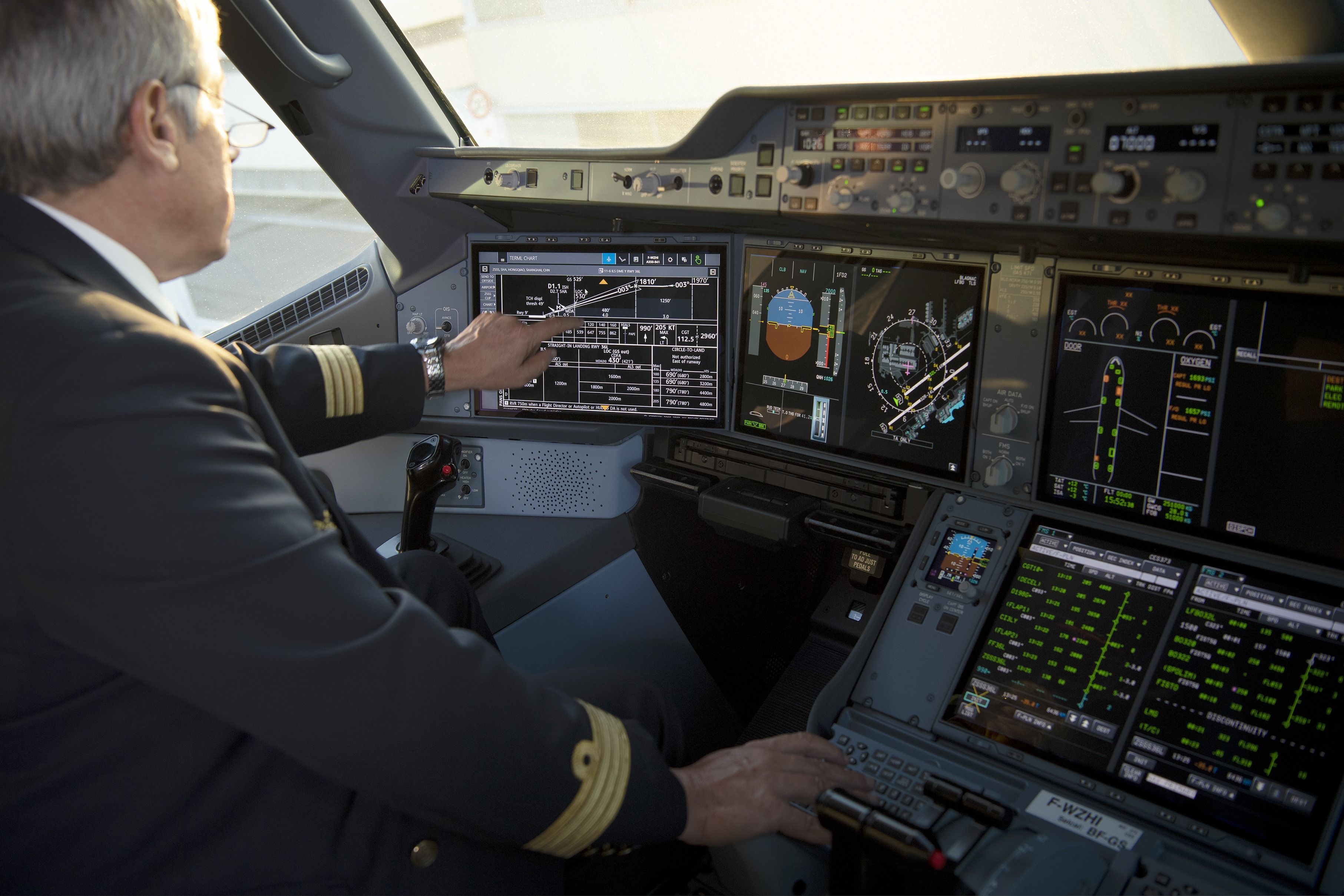 An A350 captain sitting in the cockpit.