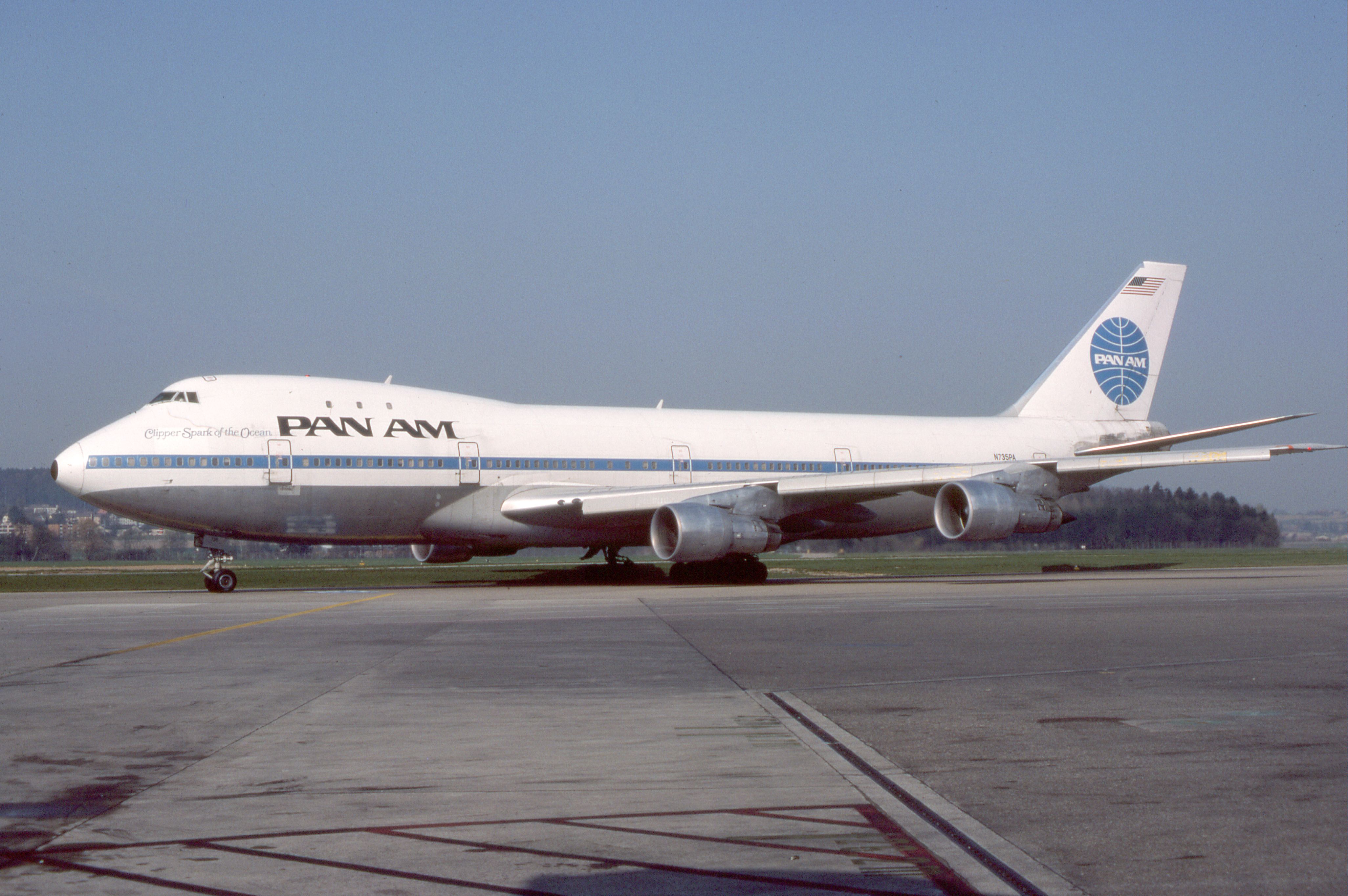 A Pan Am Boeing 747-100 taxiing to an airport gate.
