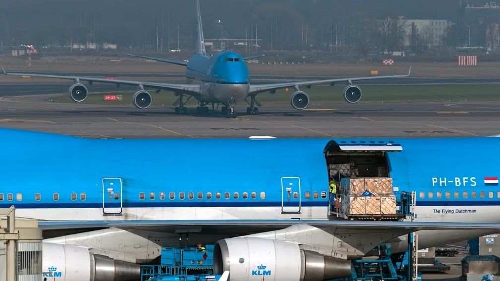 Two KLM Boeing 747 Combi aircraft at an unidentified airport.