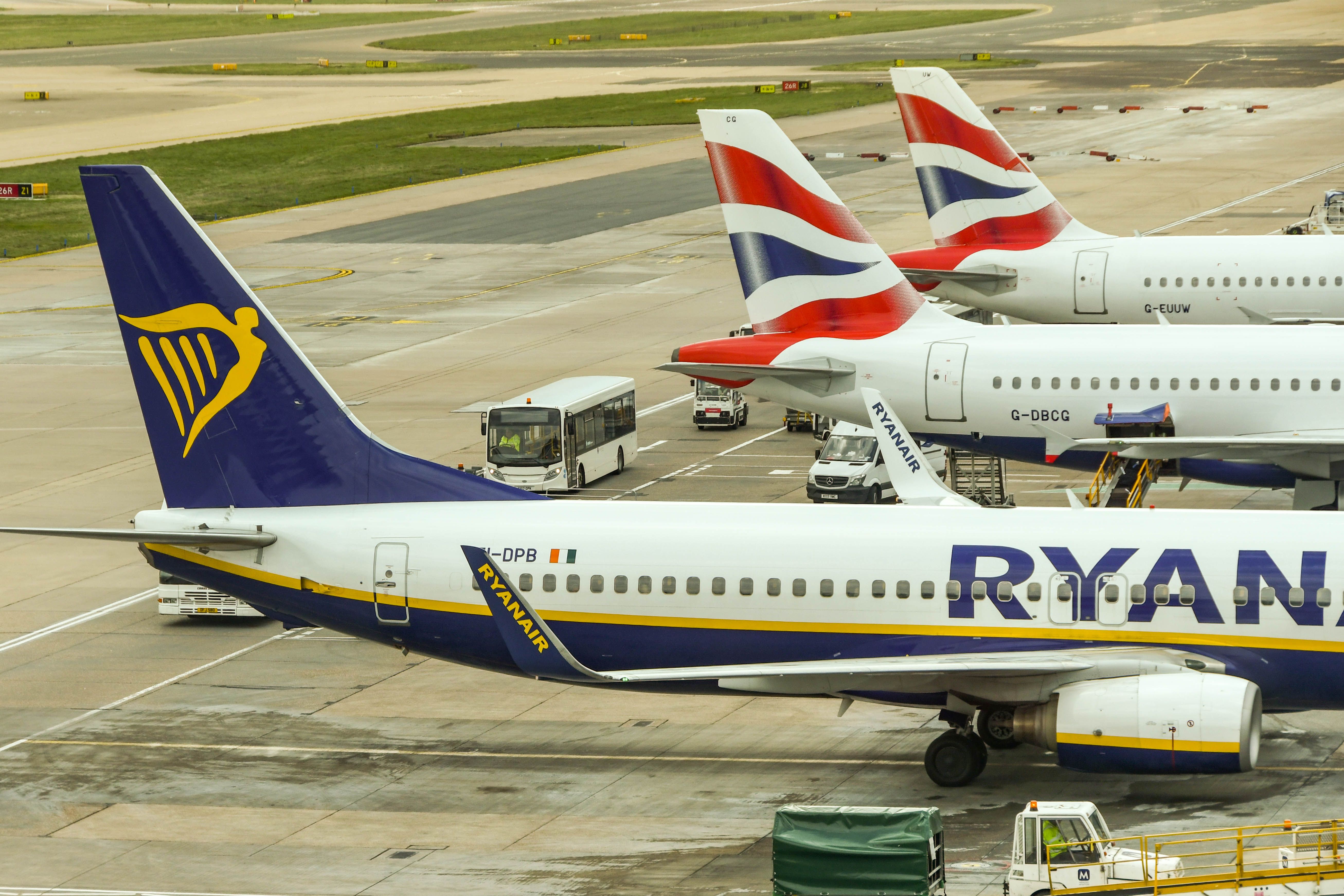A Ryanair Boeing 737 parked alongside a British Airways jet at London Gatwick Airport.