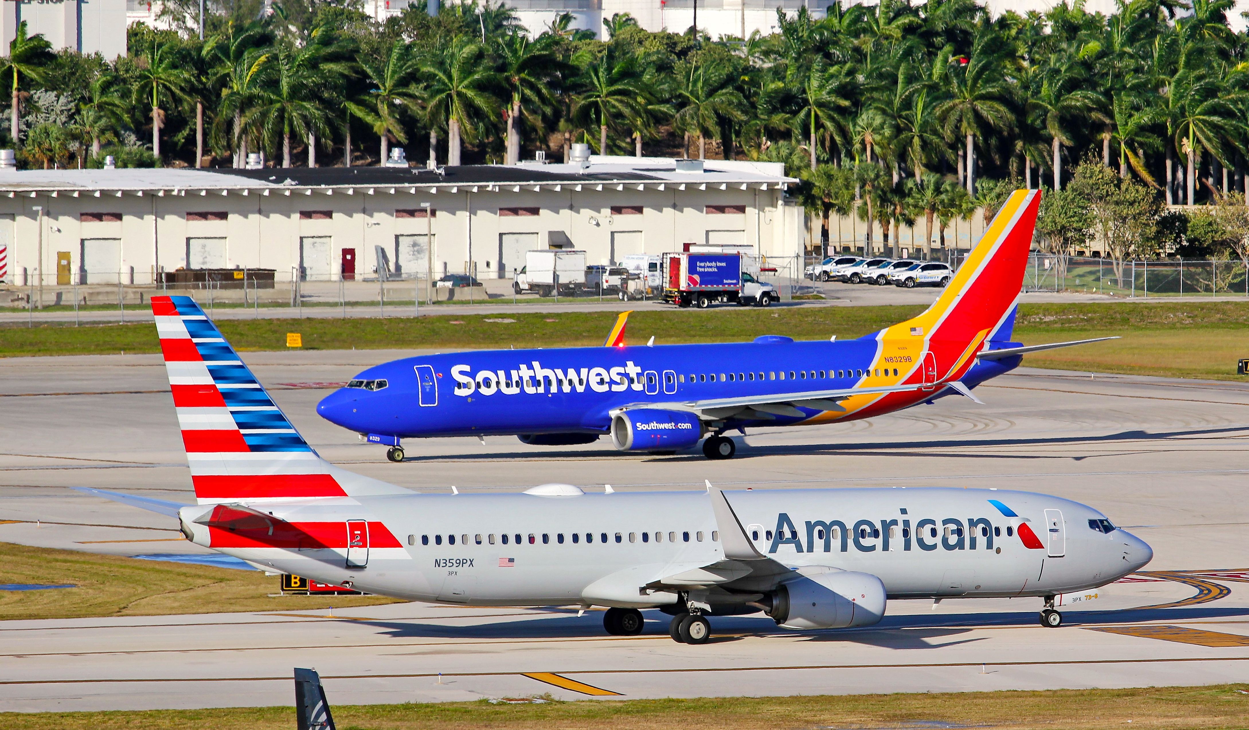 A Southwest Airlines Boeing 737 and an American Airlines Boeing 737 taxiing in Fort Lauderdale.