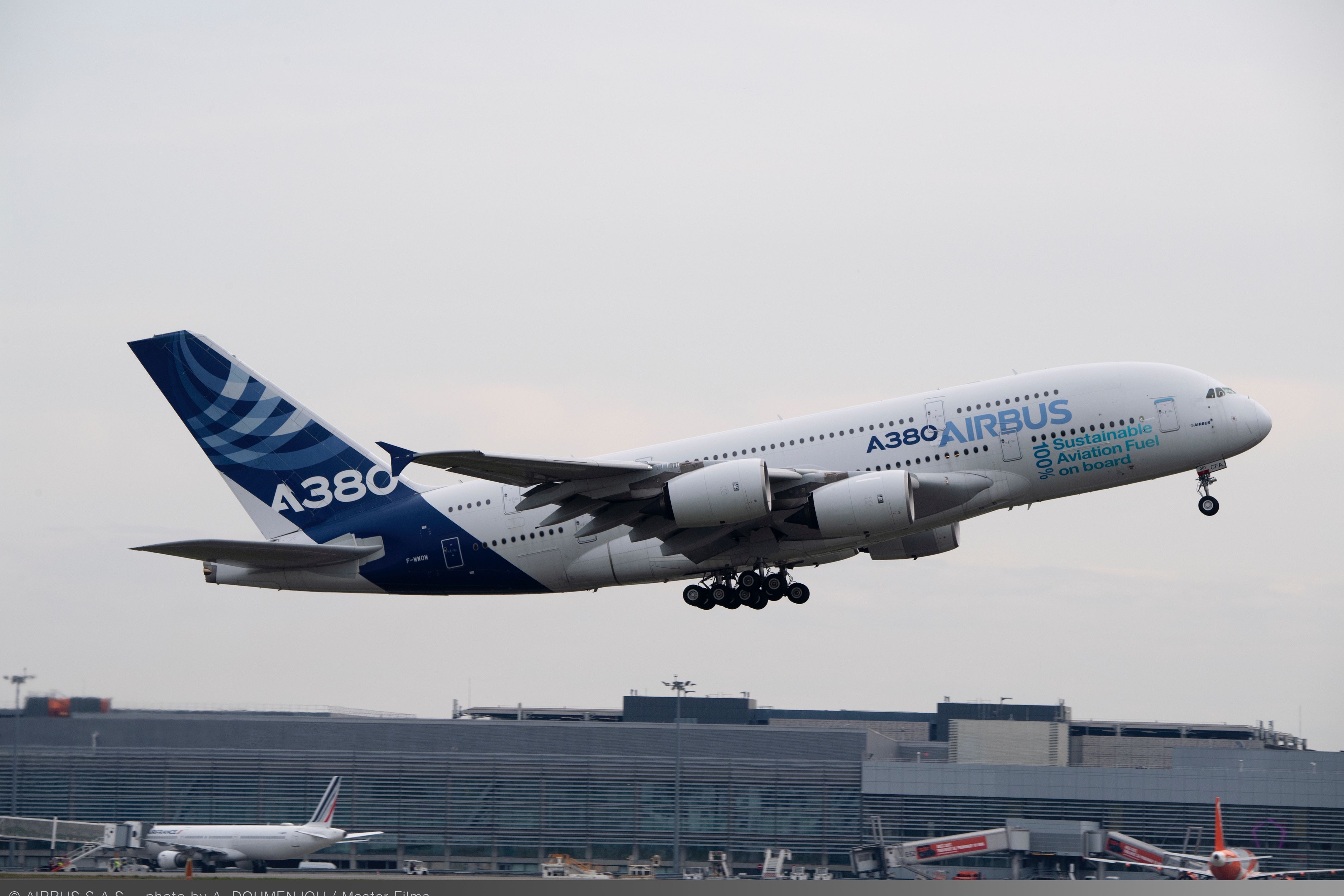 An Airbus A380 in house livery taking off.