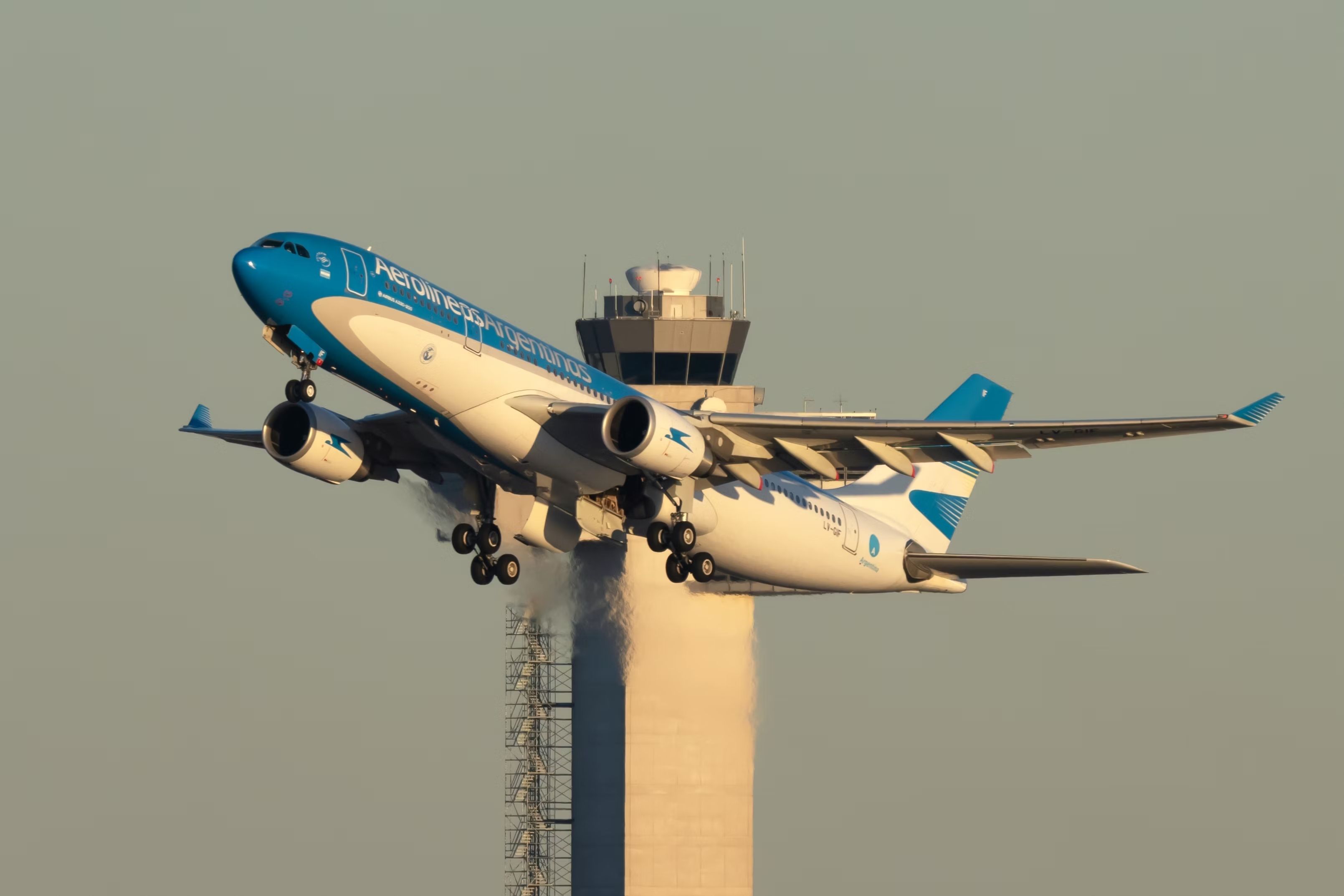 An Aerolineas Argentinas Airbus A330-202 flying in the sky.