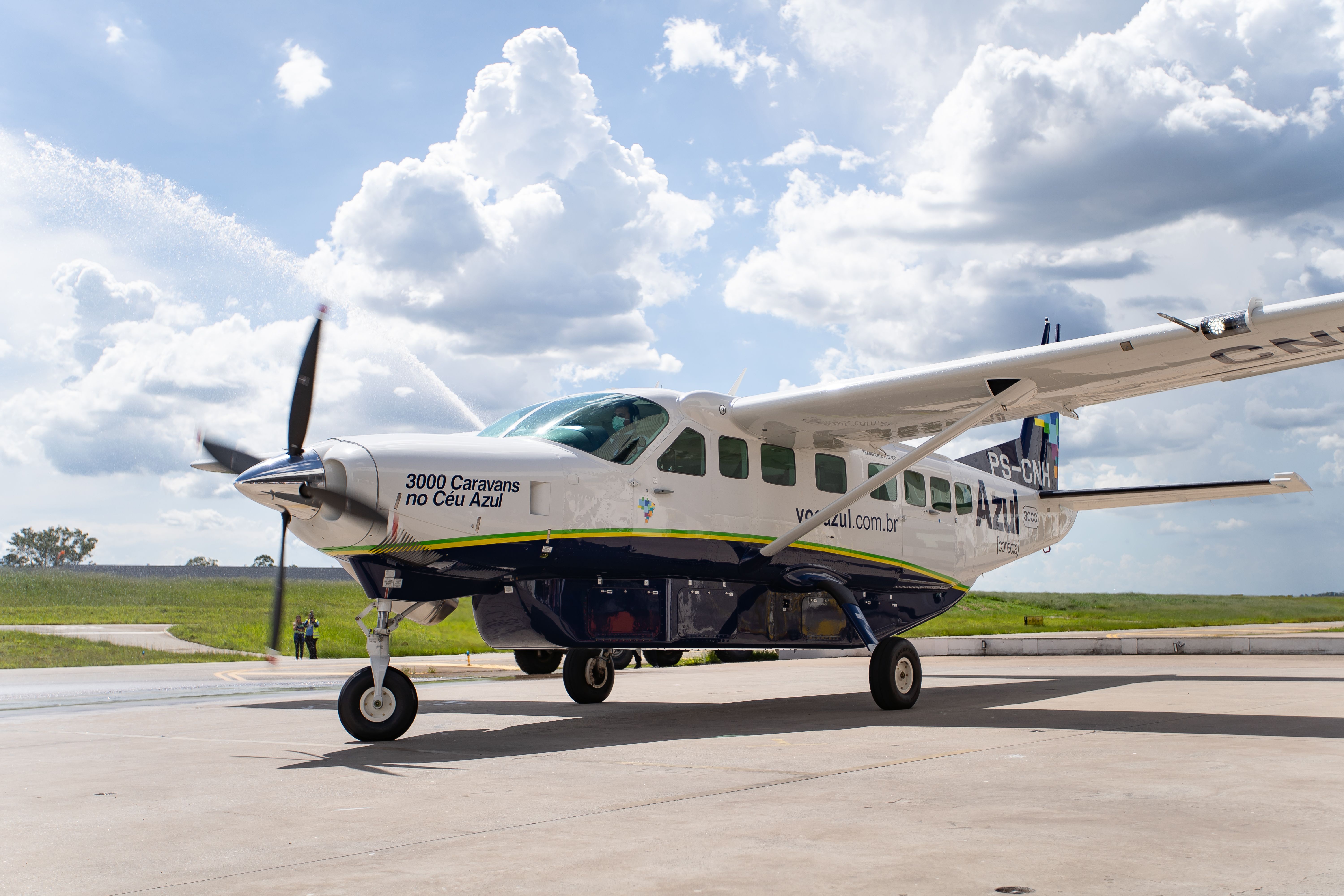 An Azul Conecta Cessna aircraft parked at an airport.
