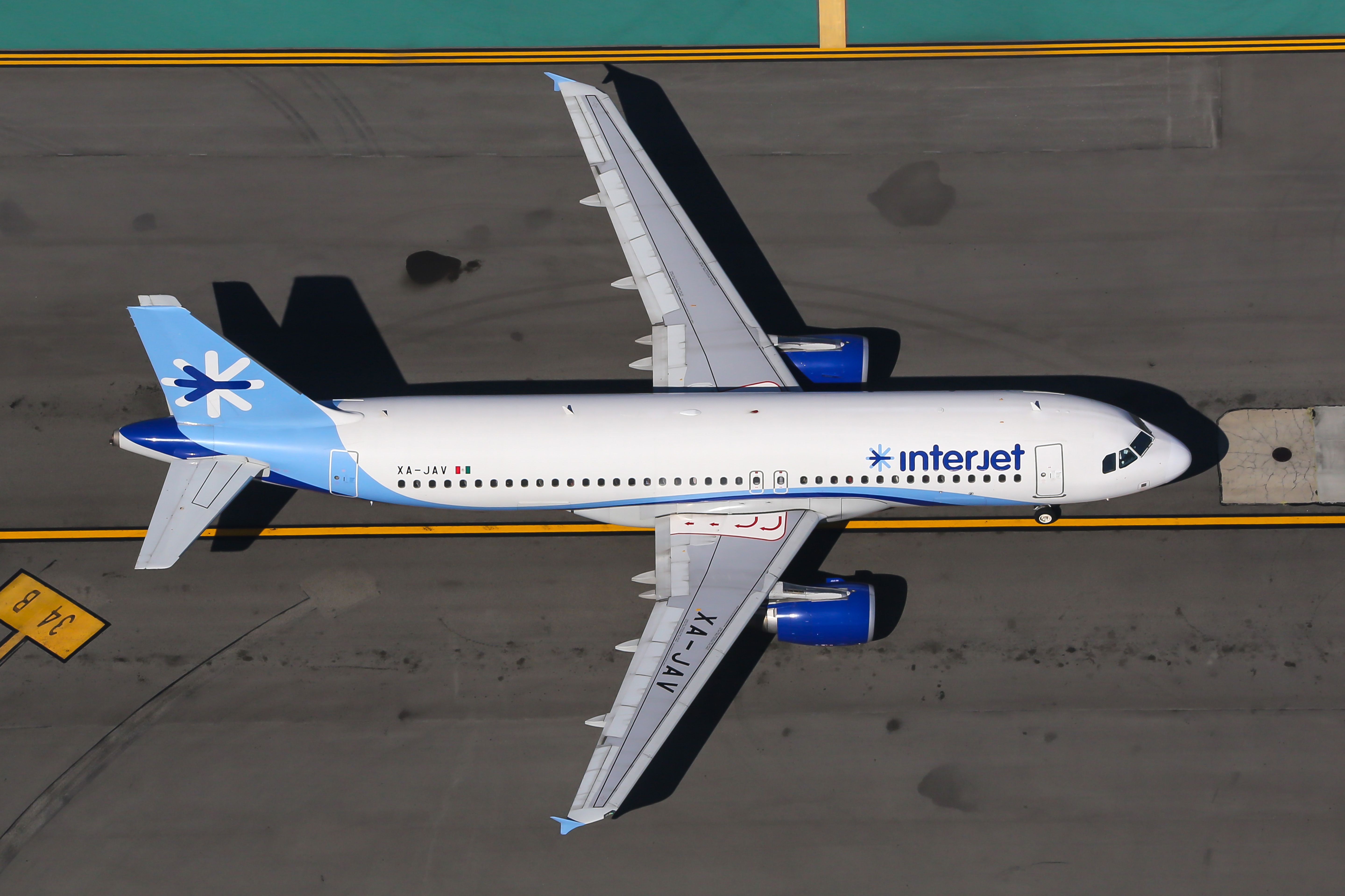 An Interjet Airbus A320 aircraft taxiing to the runway.