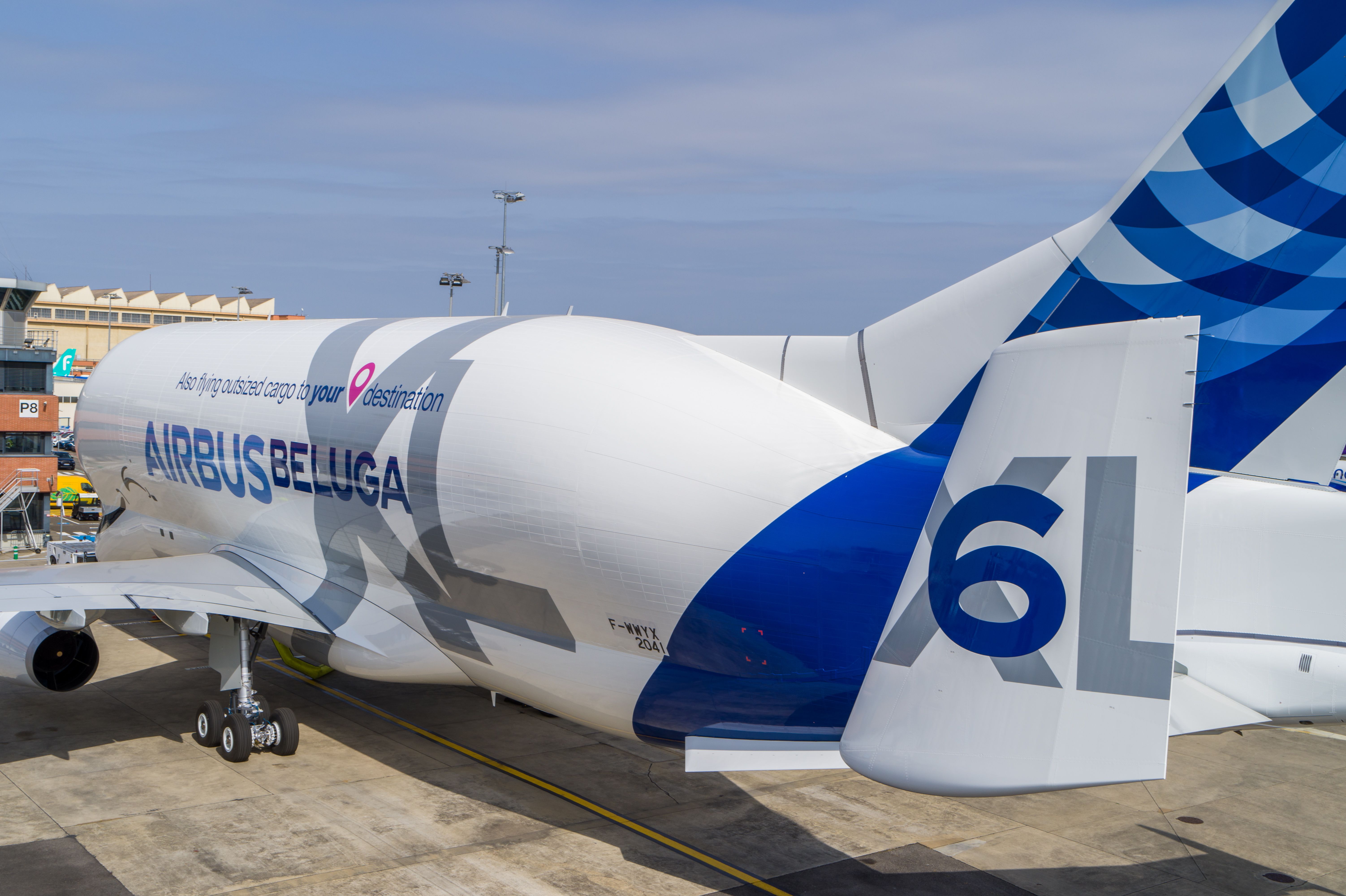 An Airbus BelugaXL parked at an airport.