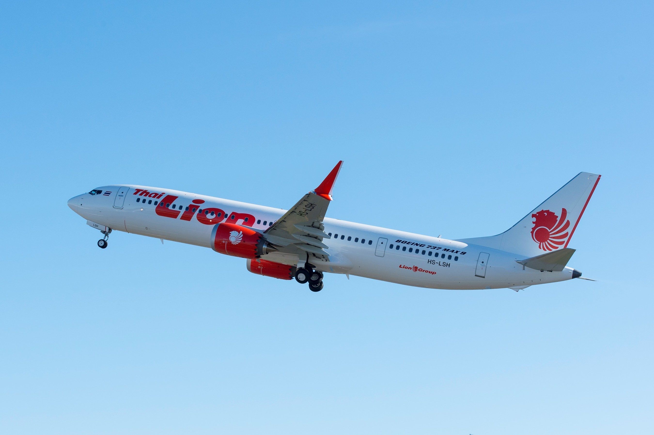 A Thai Lion Air Boeing 737 MAX 9 flying in the sky.