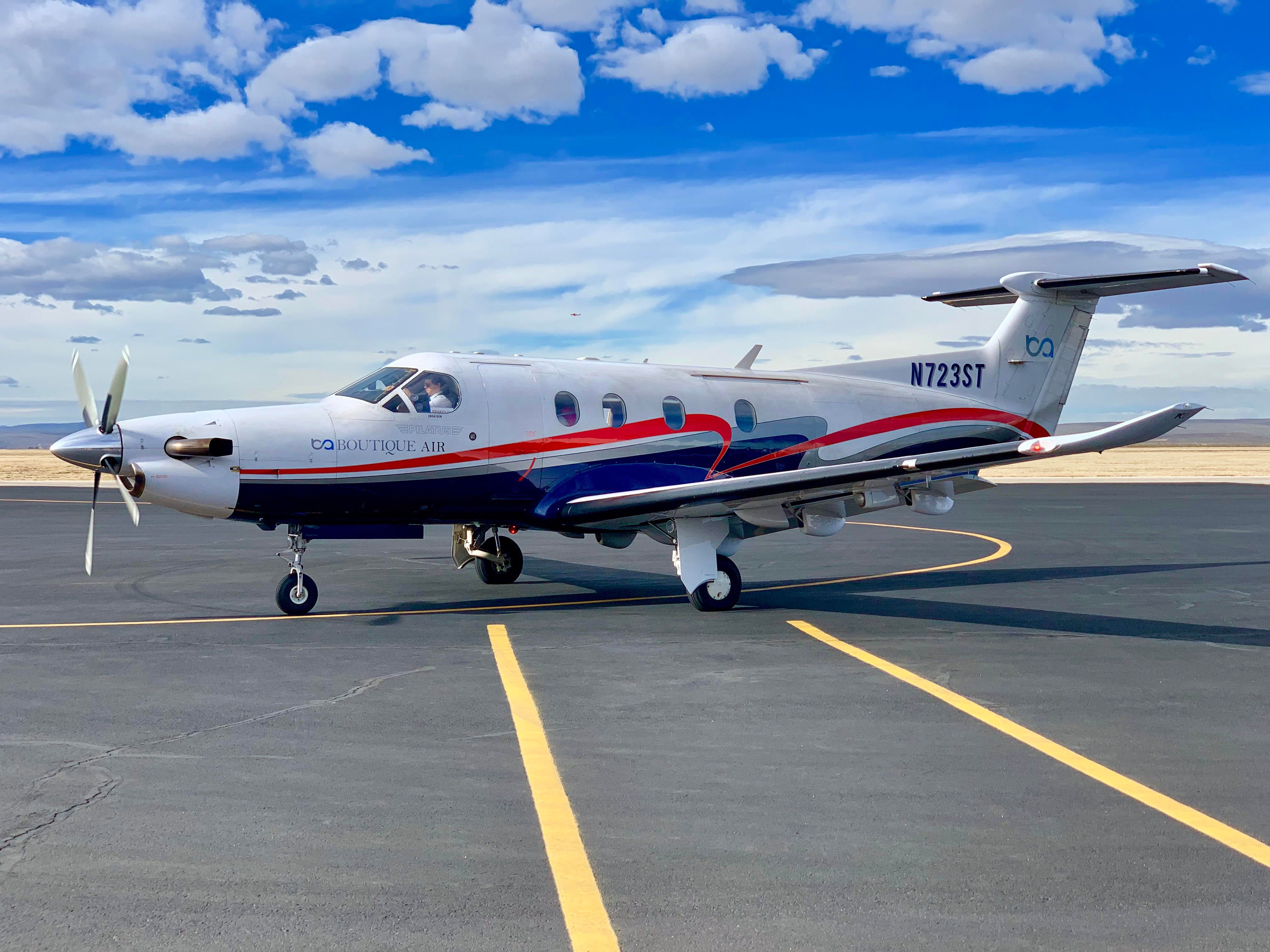 A Boutique Air aircraft parked at Cavern City Airport.