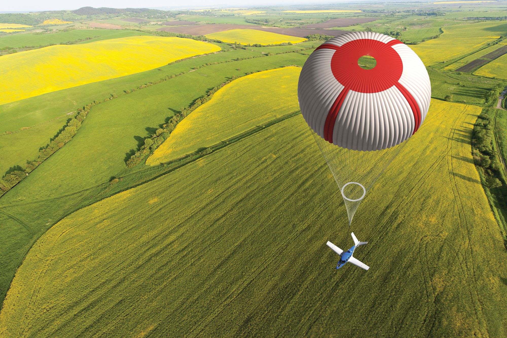 A Cirrus SF 50 Vision Jet with a deployed CAPS parachute.