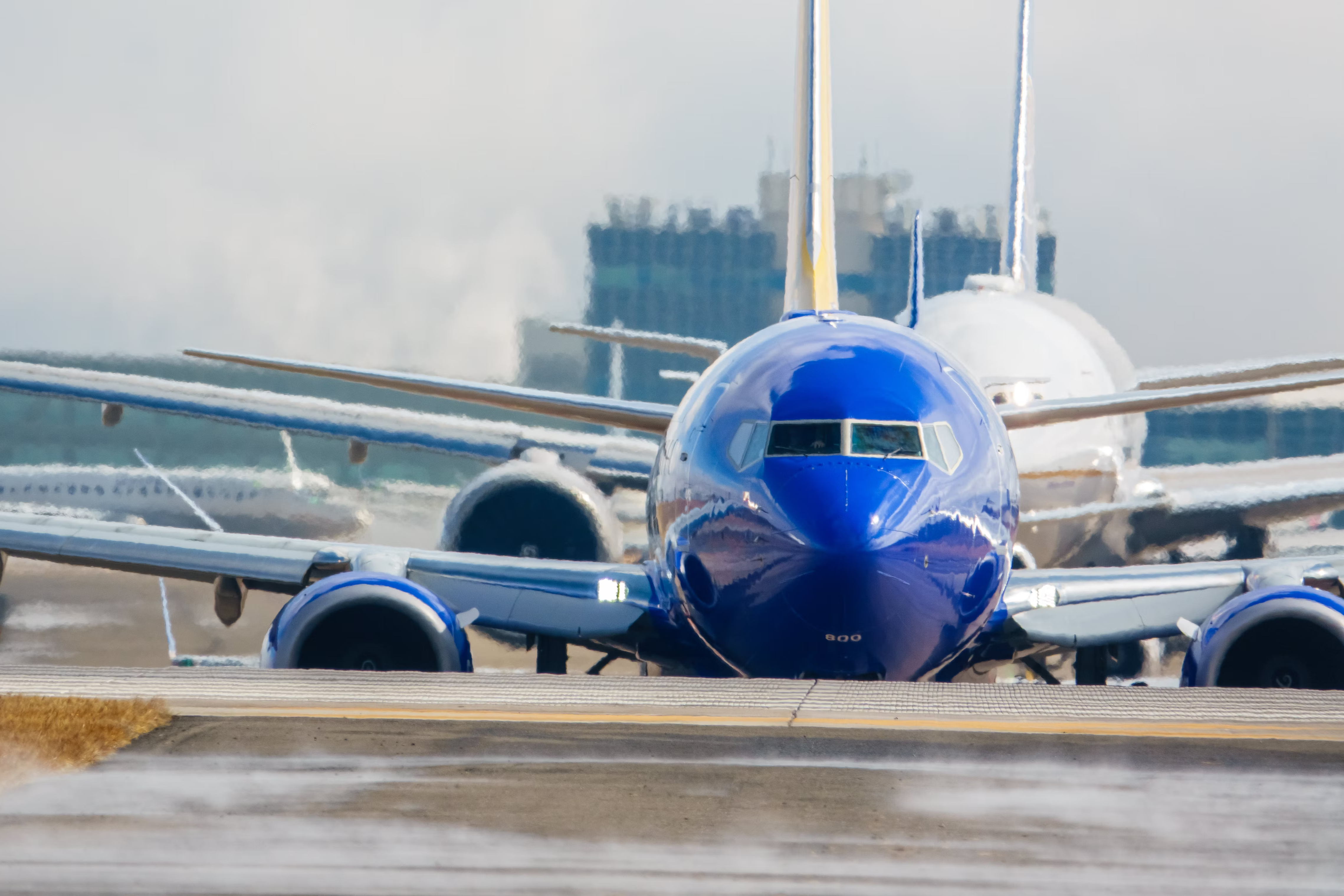 A Southwest Airlines aircraft lined up on a taxiway at Denver International Airport.