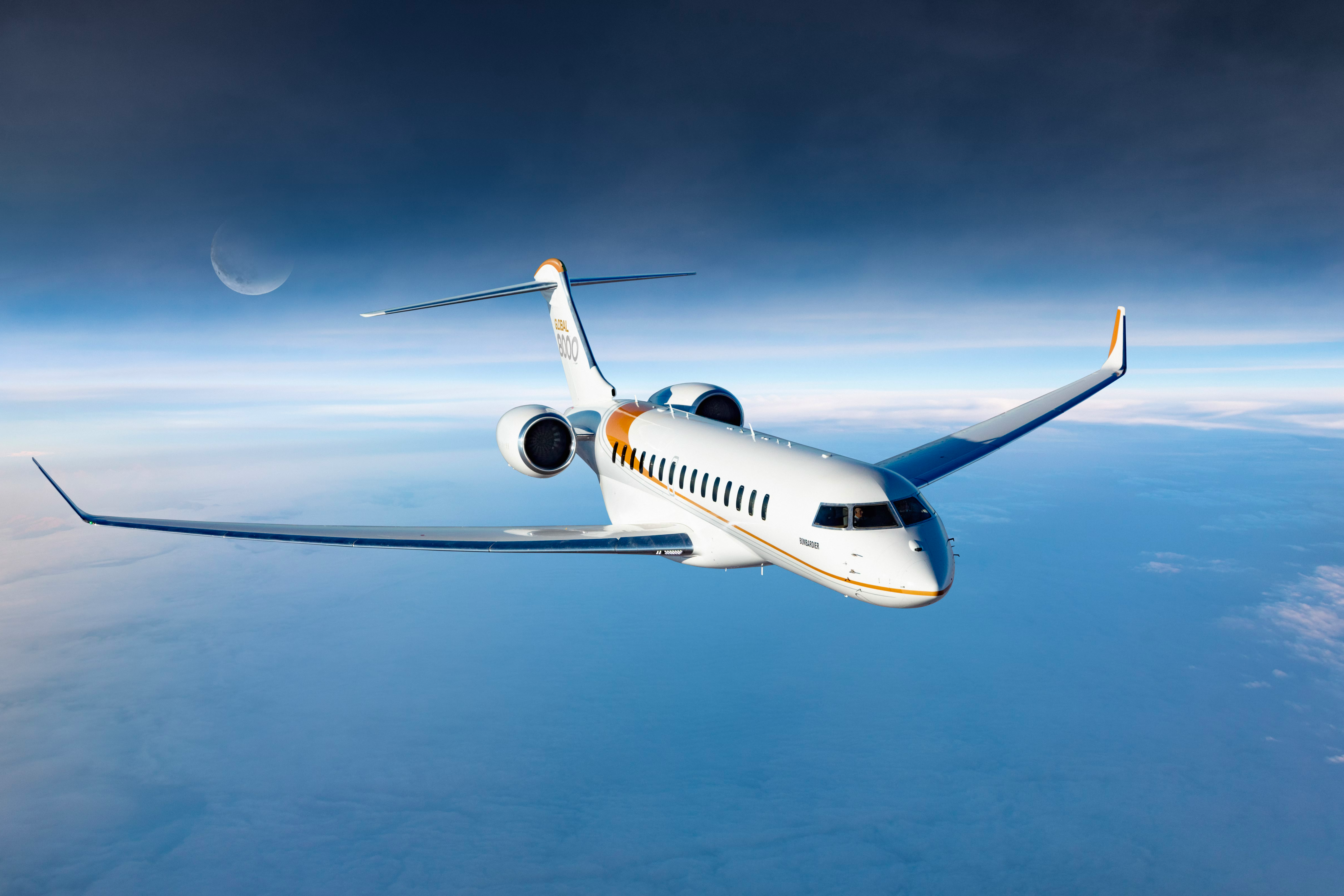 A Bombardier Global 8000 flying in the sky.