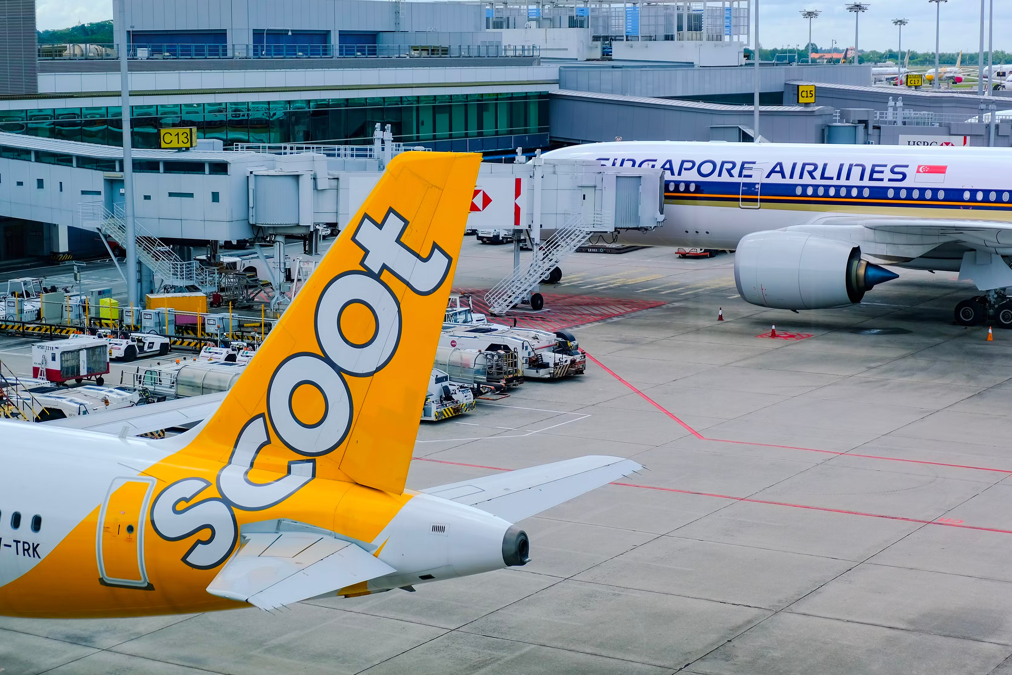 Singapore AIrlines and Scoot Aircraft Parked At Gates At Singapore Changi Airport.