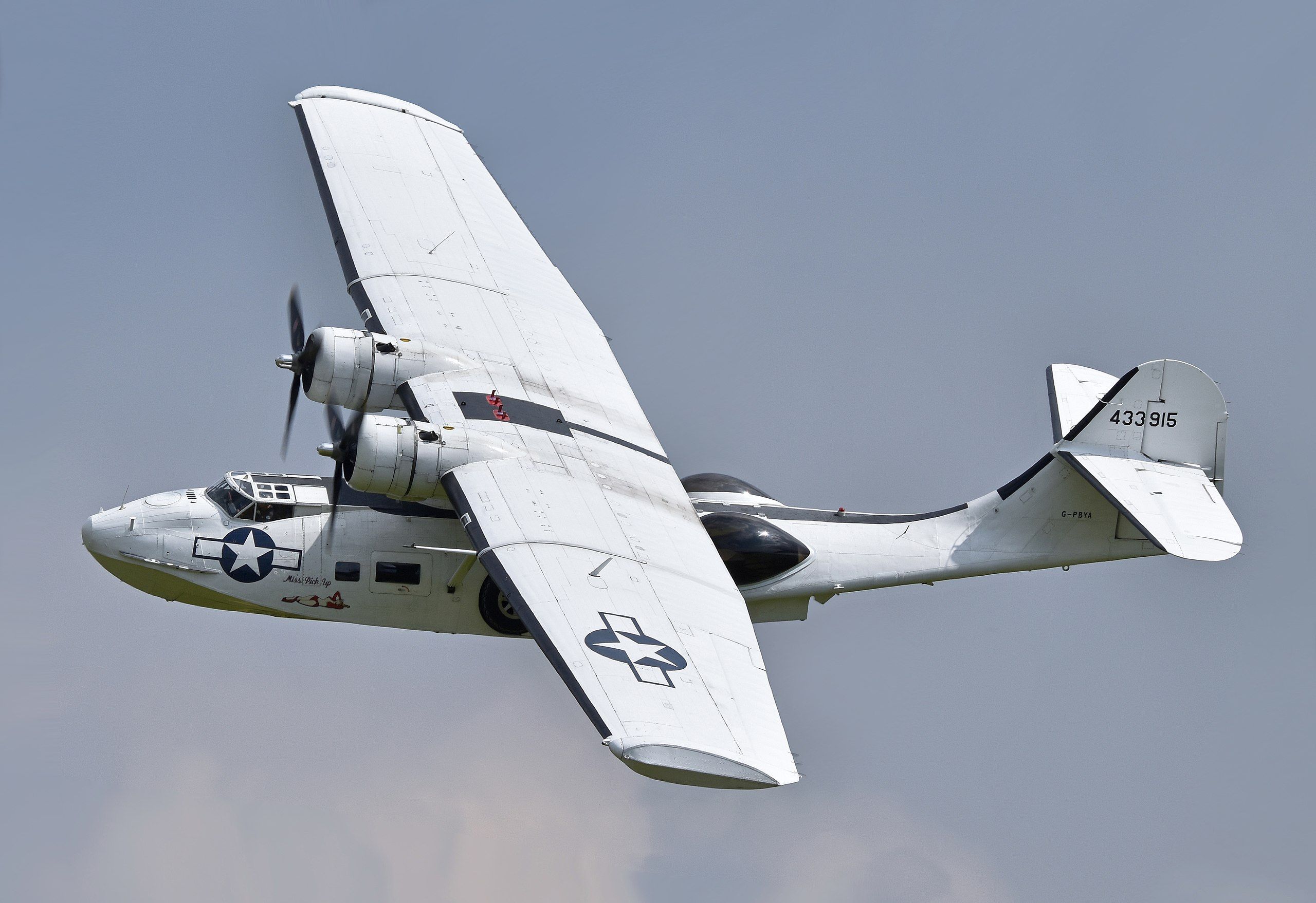 A Catalina flying boat flying in the sky.