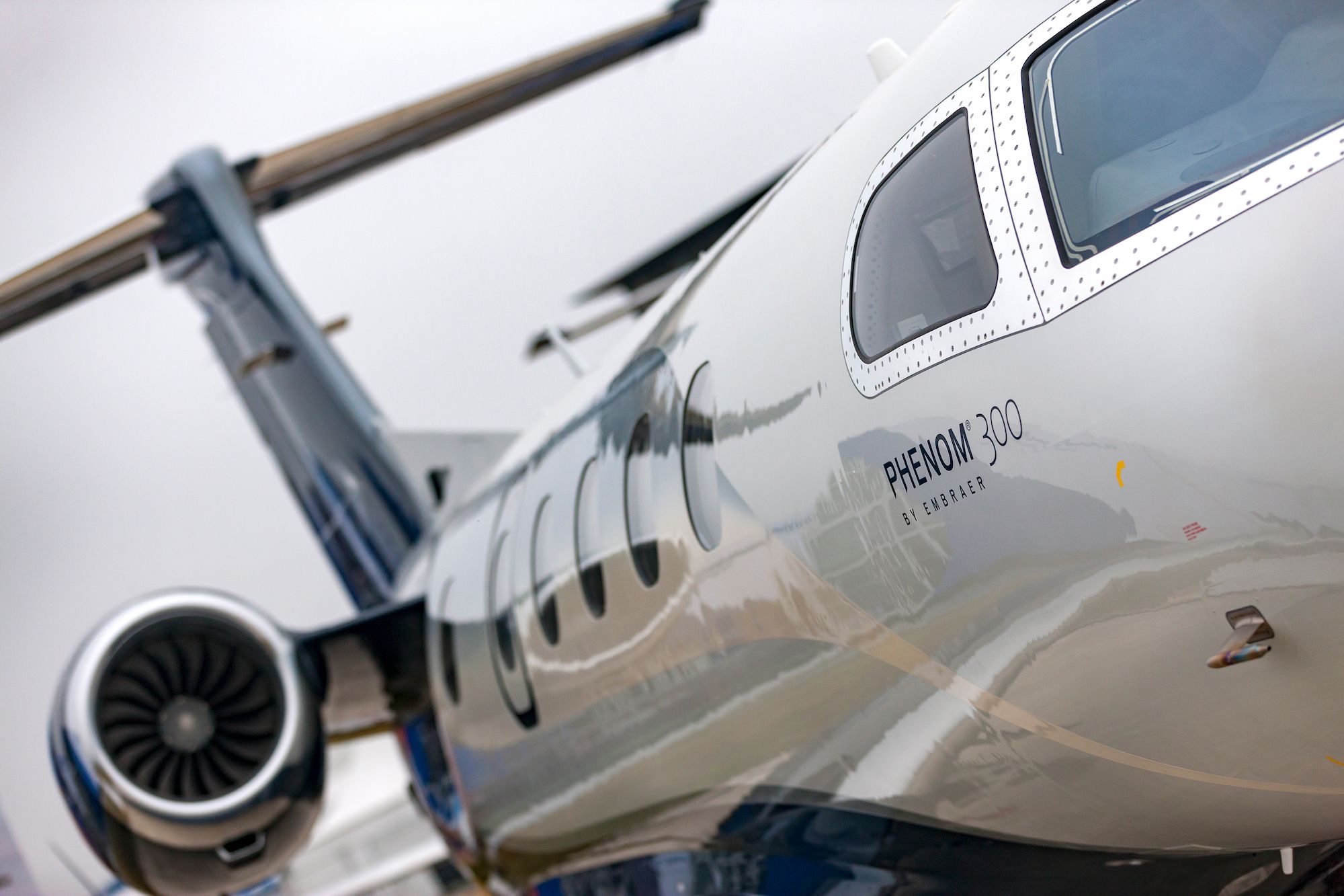 A closeup of an Embraer Phenom 300.