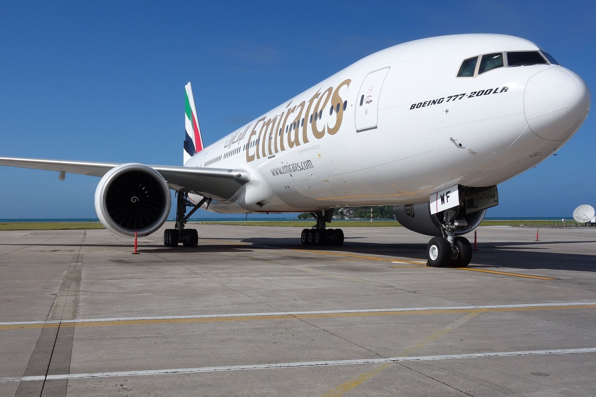 Emirates Boeing 777-200LR parked on the apron