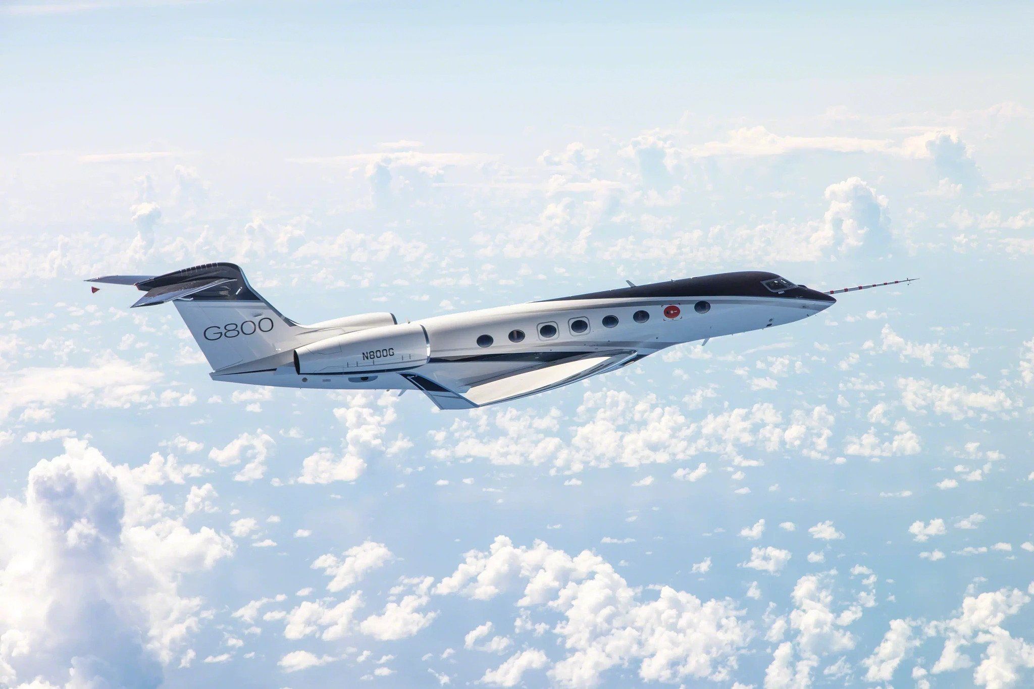 A Gulfstream G800 flying above the clouds.