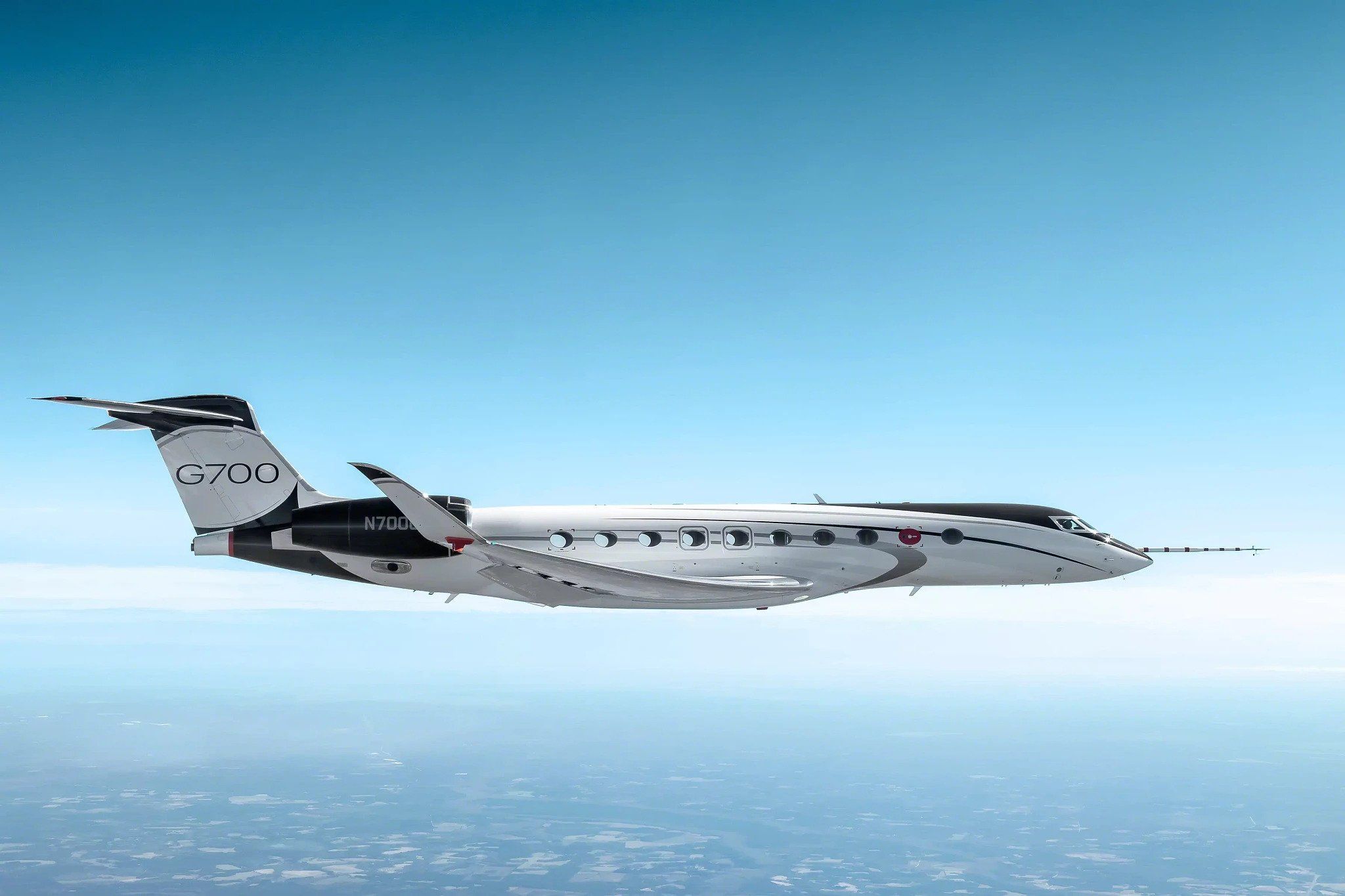 A Gulfstream G700 flying in the sky.
