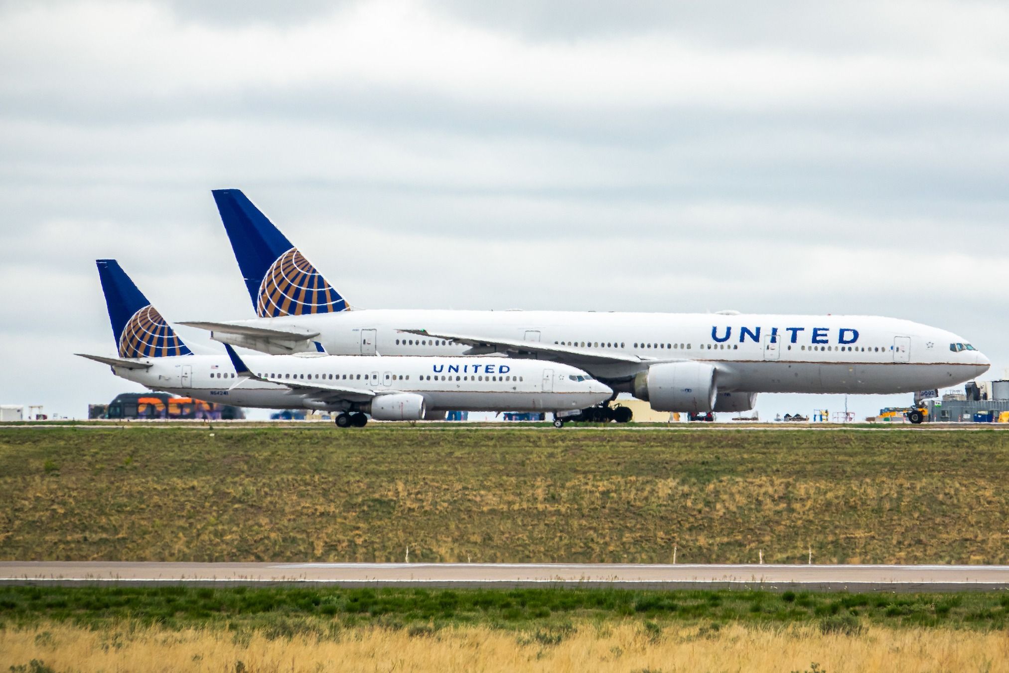 United Airlines Boeing 777-200 and 737-800 at Denver International Airport.