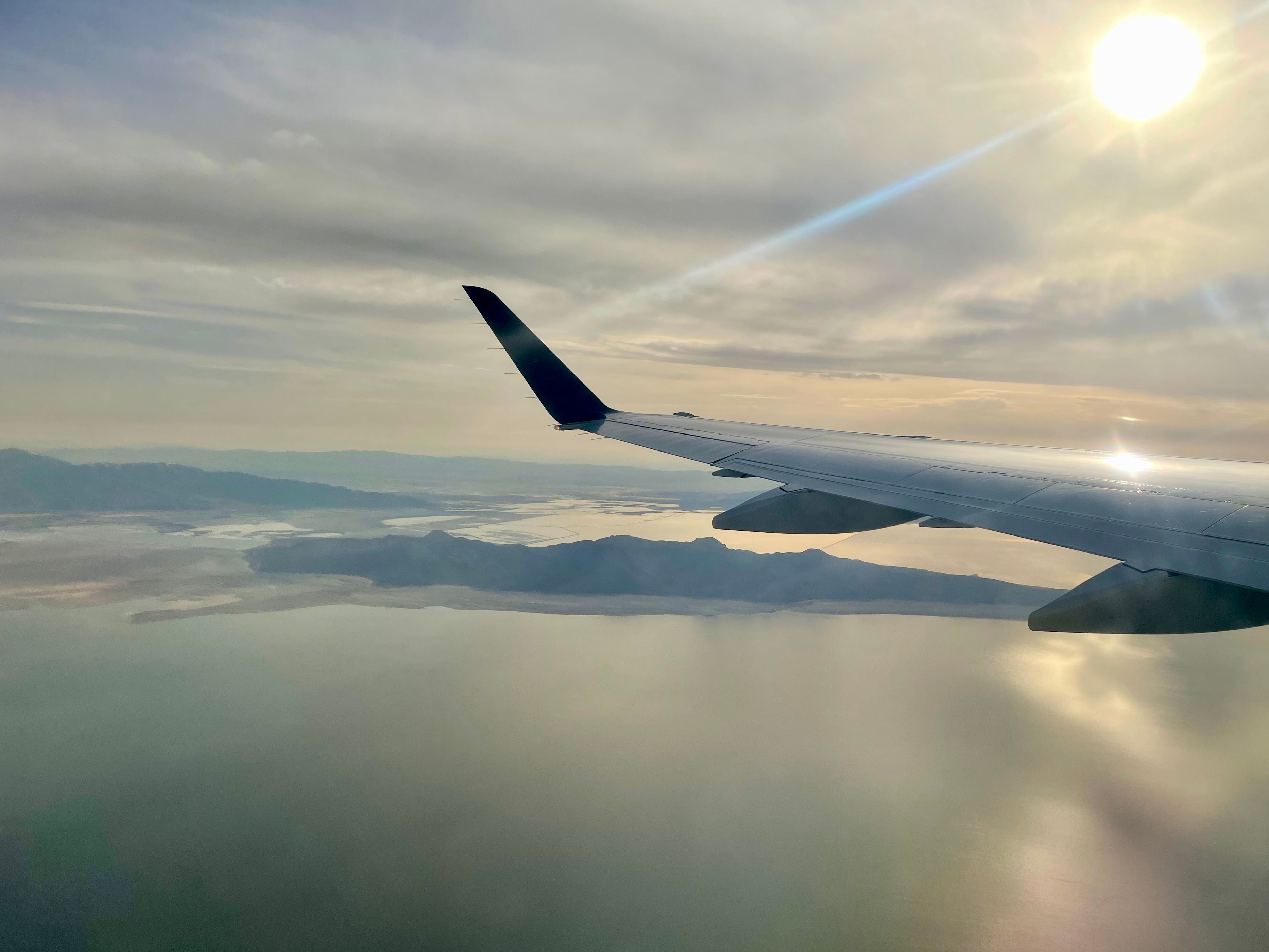 The Great Salt Lake seen from outside a passenger aircraft window.