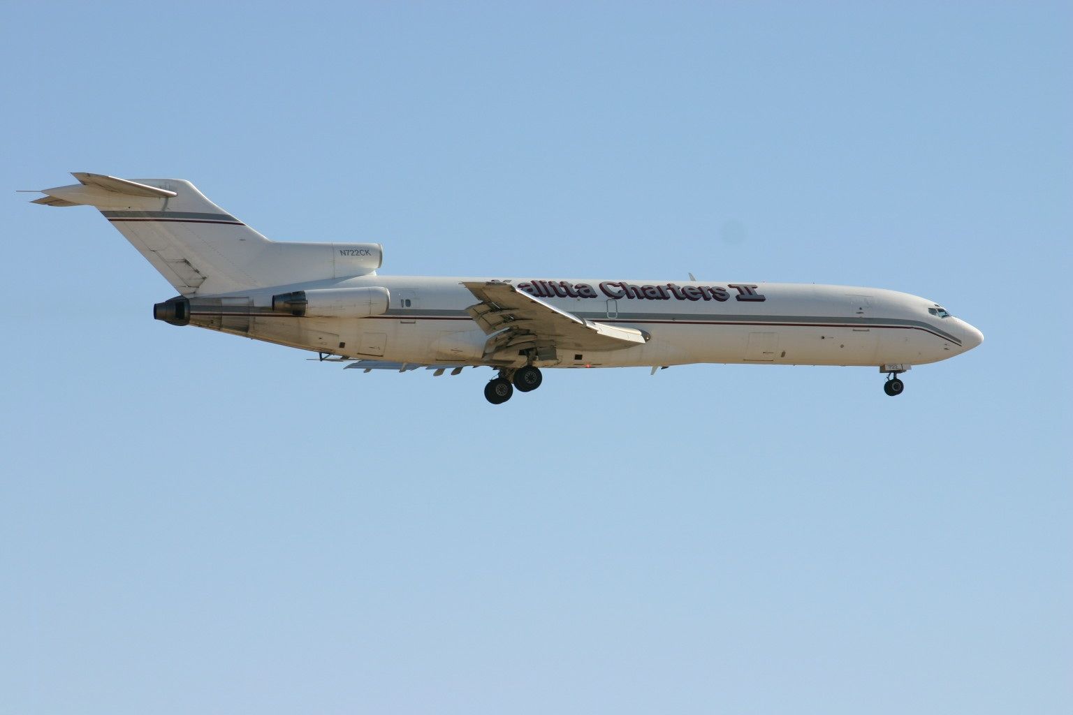 A Kalitta Boeing 727F flying in the sky.
