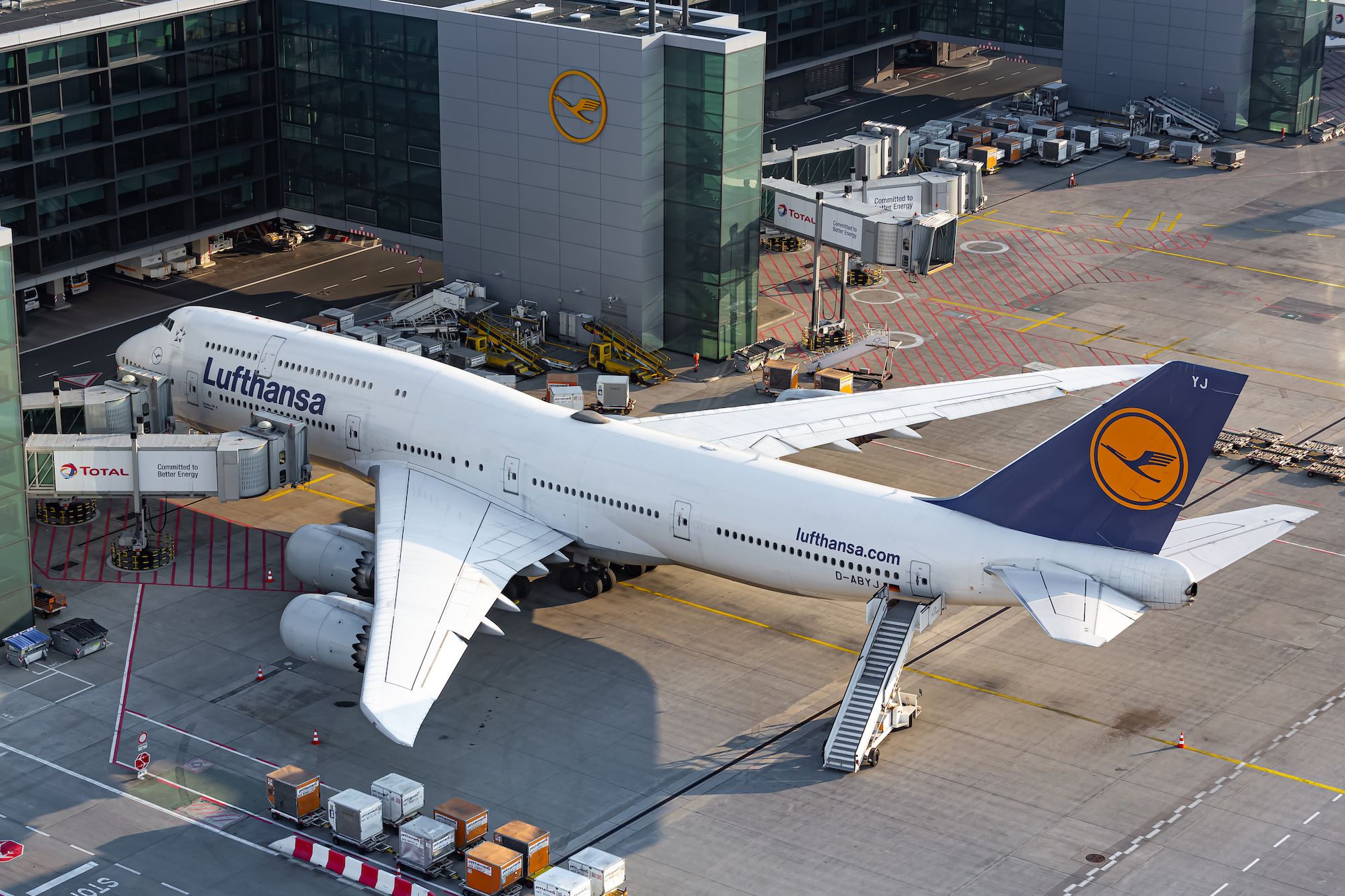 Lufthansa Boeing 747-8 parked at the gate at Frankfurt Airport.