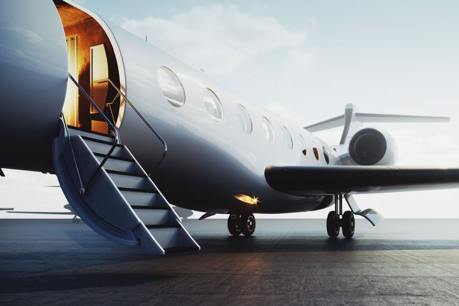 A Business jet with its boarding stairs down.