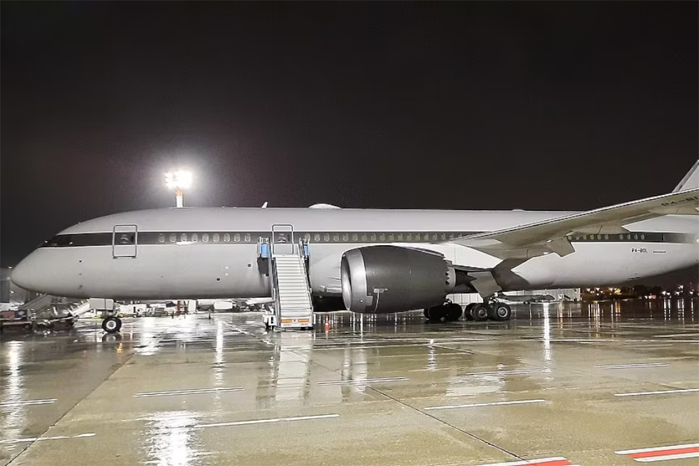 Roman Abramovich's Private Boeing 787-8 Dreamliner parked on an airport apron.