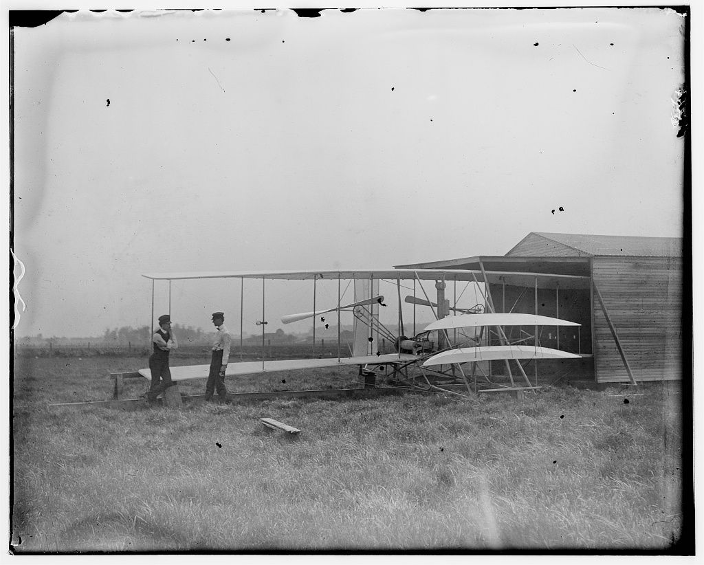 Wilbur and Orville Wright with their second powered machine; Huffman Prairie, Dayton, Ohio