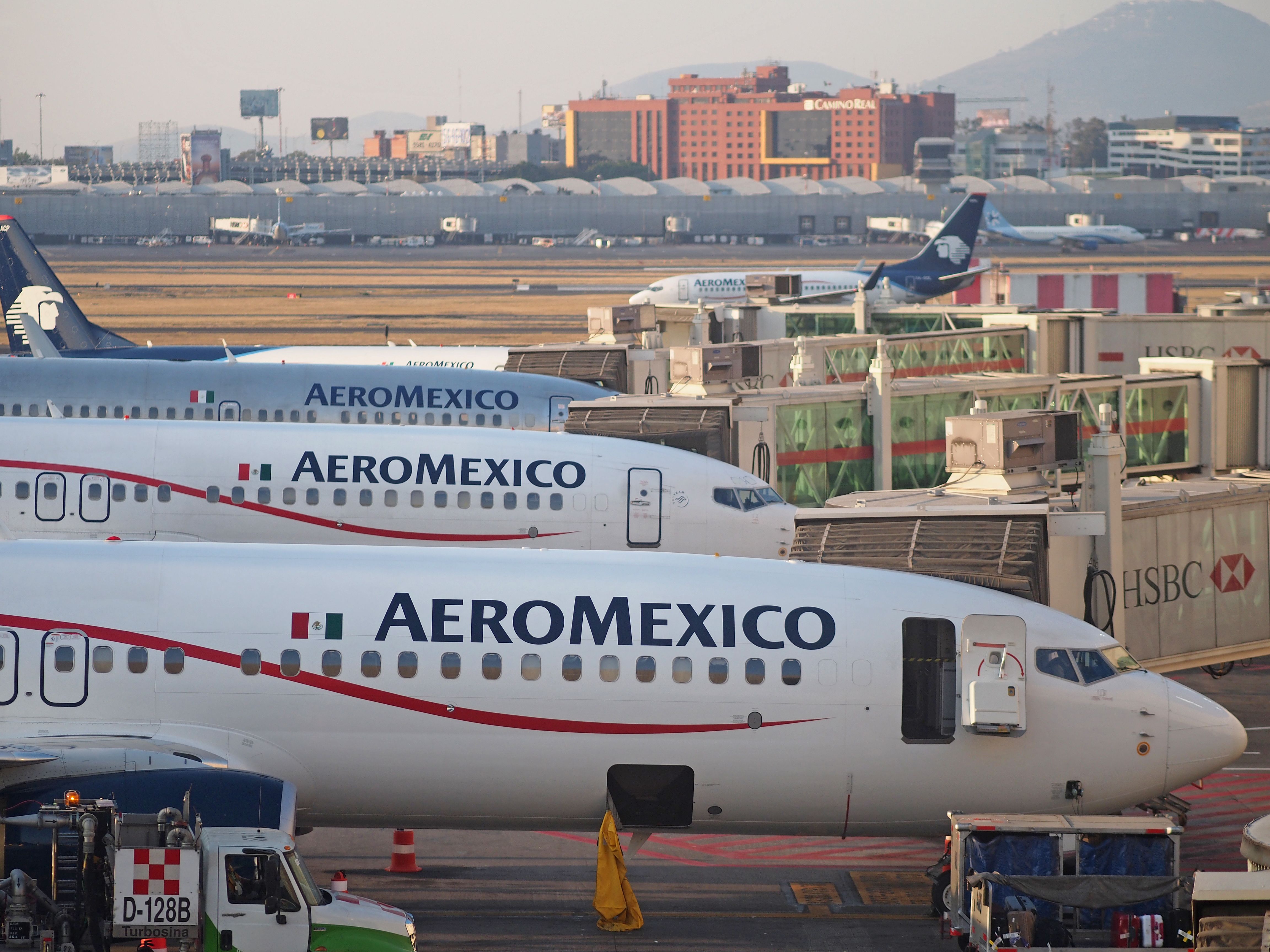 Several Aeromexico aircraft lined up at Mexico City Airport.