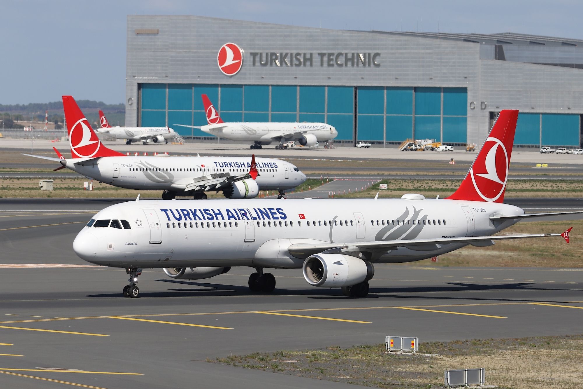 Several Turkish Airlines aircraft on the ground at Istanbul Airport.